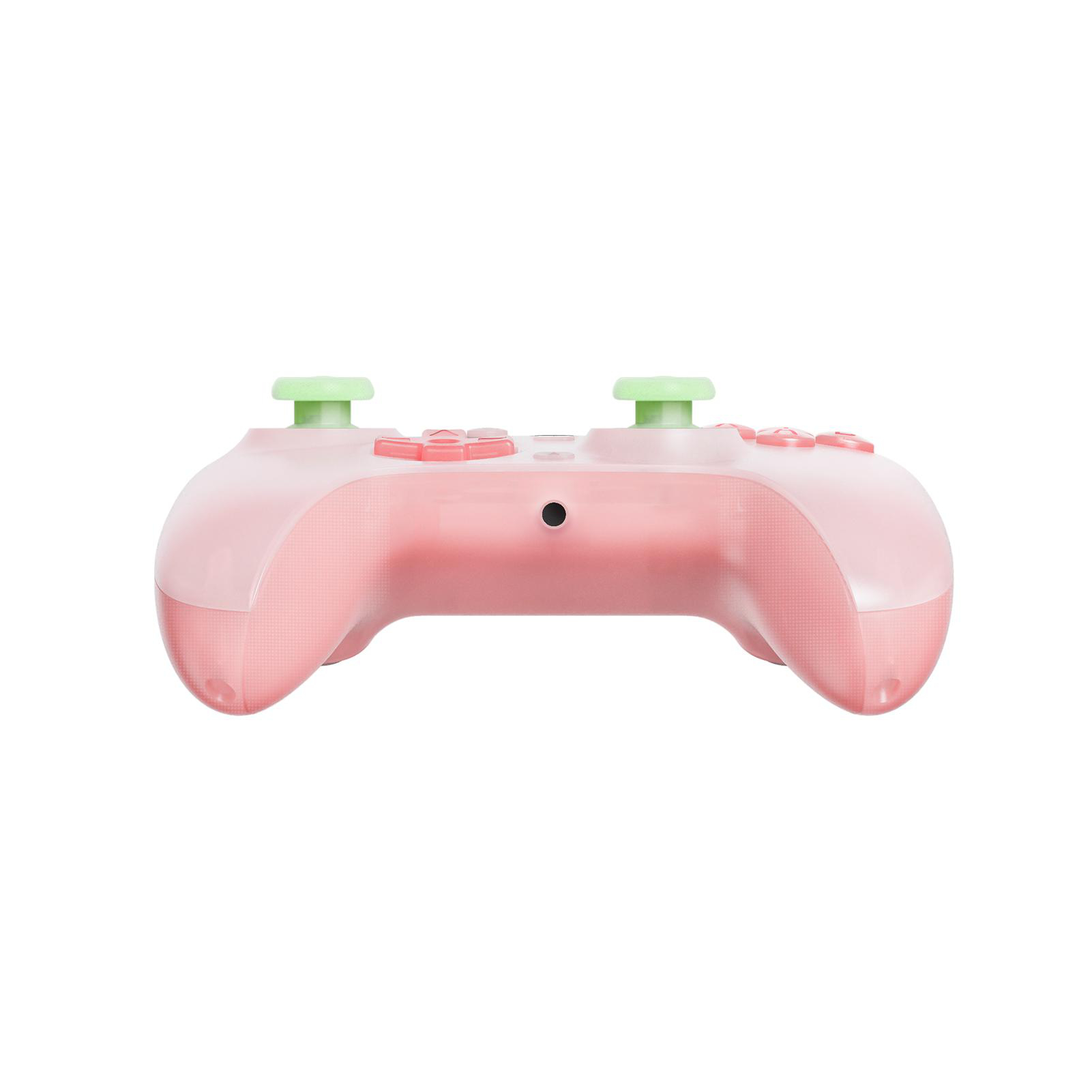 Rosa Gamecontroller mit grünen Joysticks und rosa Knöpfen, isoliert auf weißem Hintergrund.