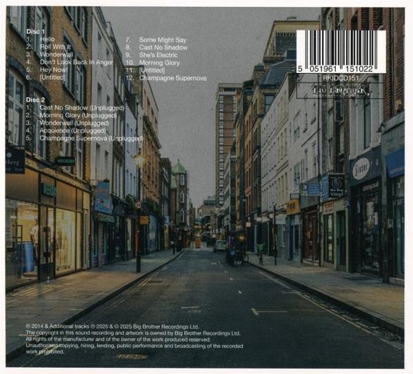 Albumcover mit einer Straßenszene mit Gebäuden. Songtitel-Listen links und ein Barcode rechts.