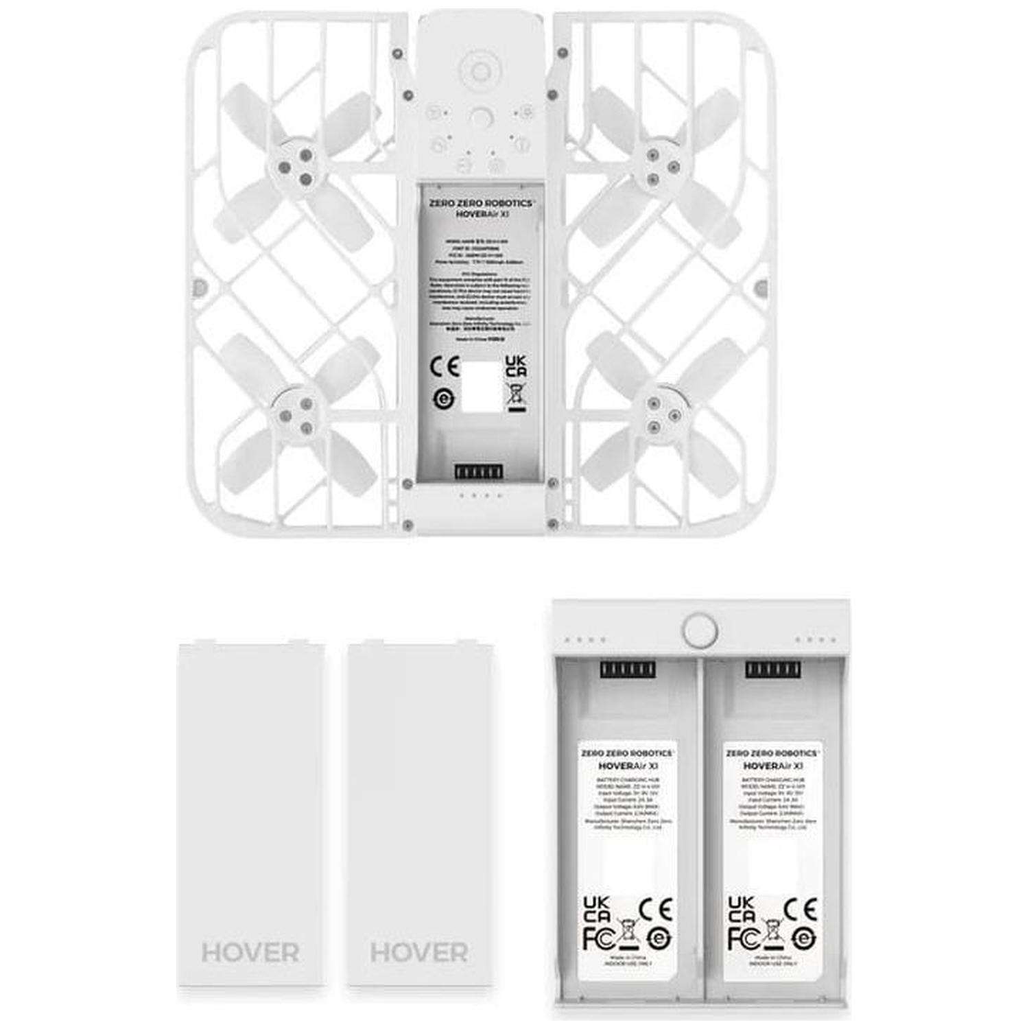 Witte drone met vier propellers, twee batterijen en een oplaadstation. Op de drone en de batterijen staat 'HOVER'.