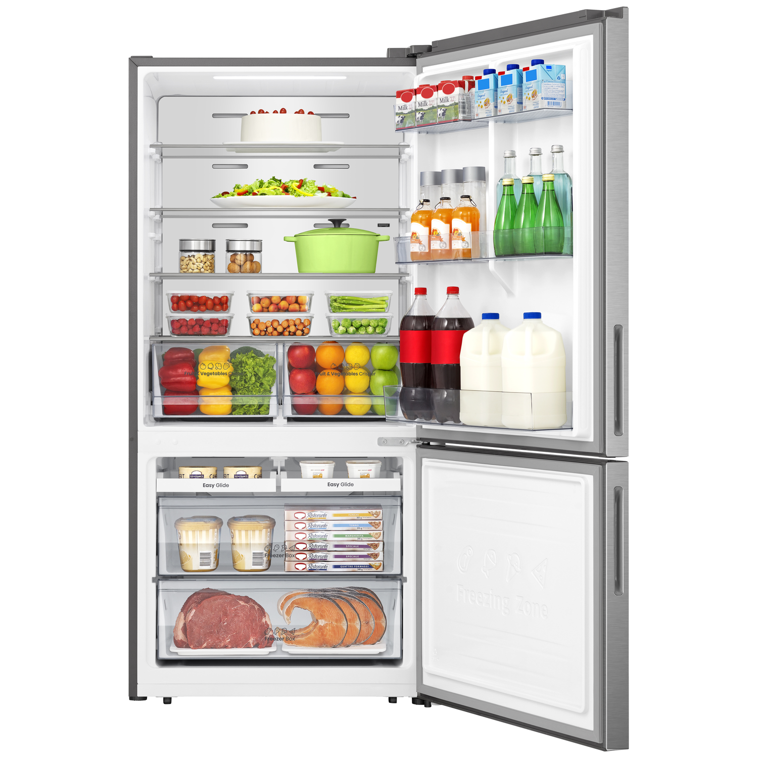 Open refrigerator filled with food: cake, salad, vegetables, fruits, drinks, milk, and frozen items. Freezer door is open.
