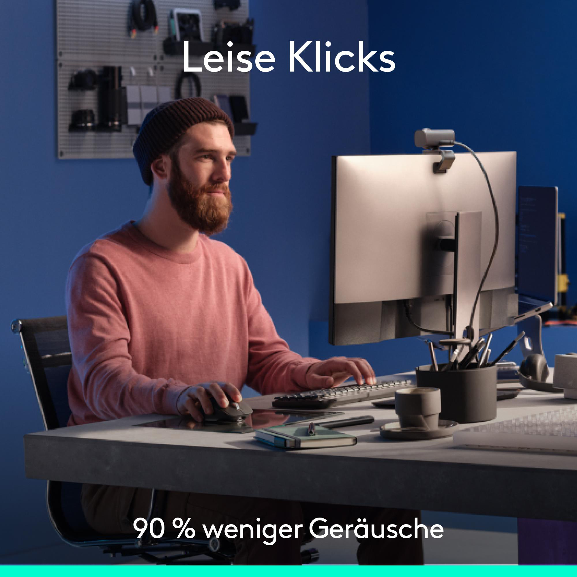 Ein Mann mit Bart benutzt einen Computer. Text sagt 'Leise Klicks' und '90% weniger Geräusche'.