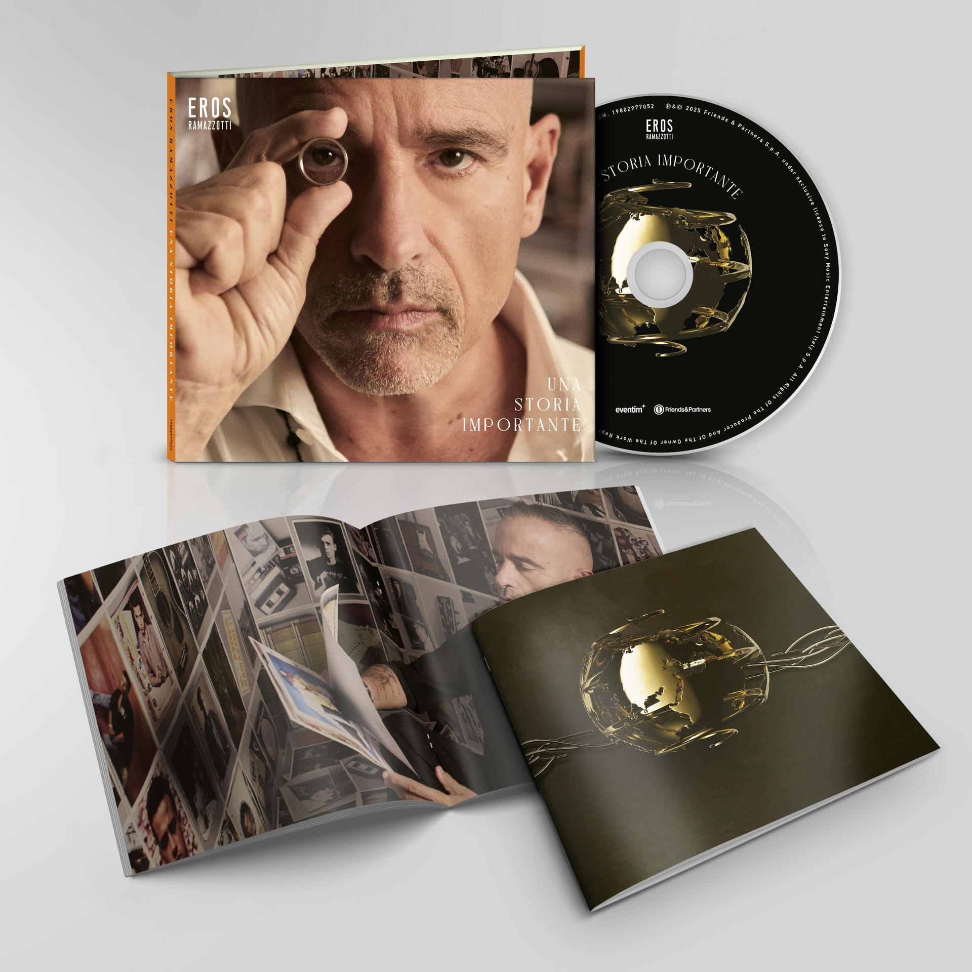 CD-Cover. Mann hält Ring. Cover sagt 'Una storia importante' von Eros Ramazzotti. Scheibe mit goldenem Globus.