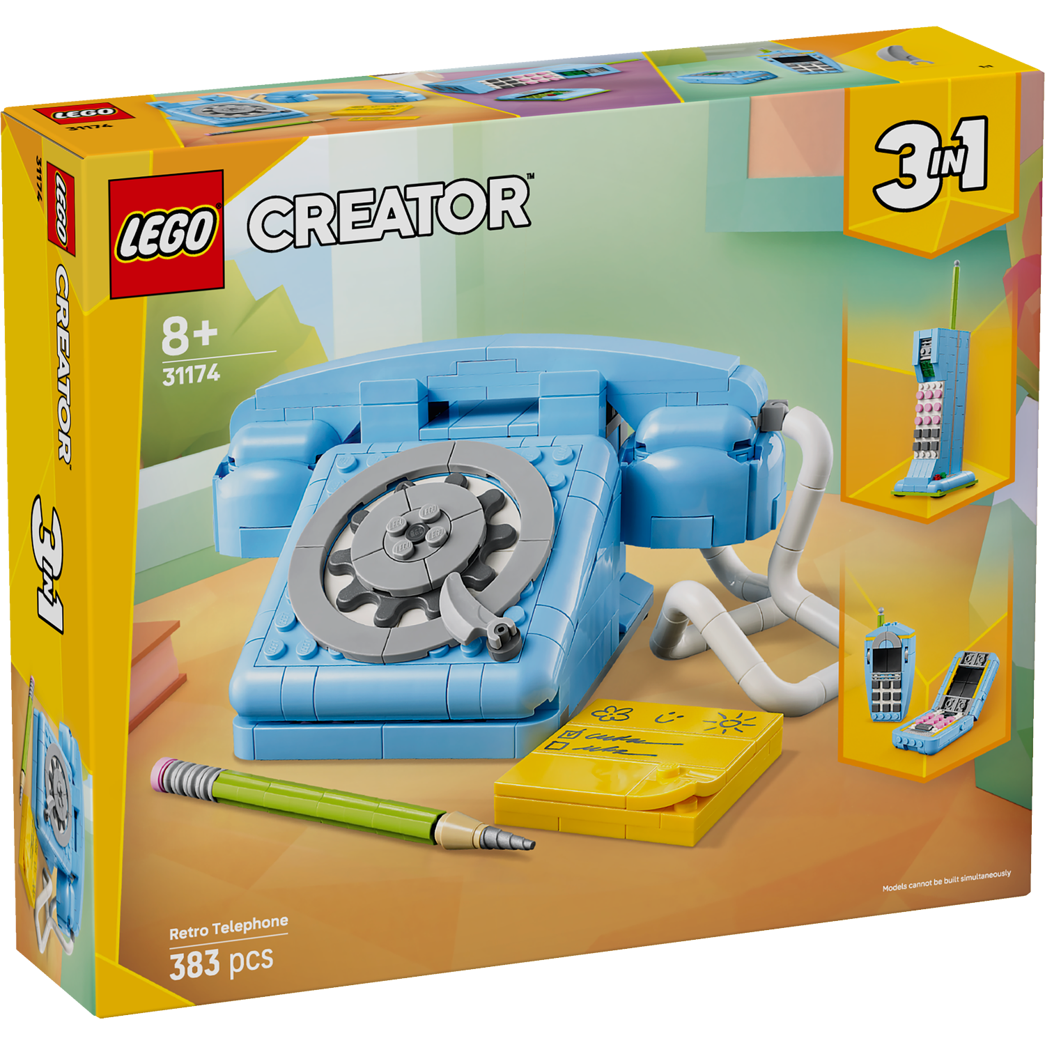 A Lego Creator set box showing a blue retro telephone, with 3 other build options. A pencil and yellow notepad are also present.