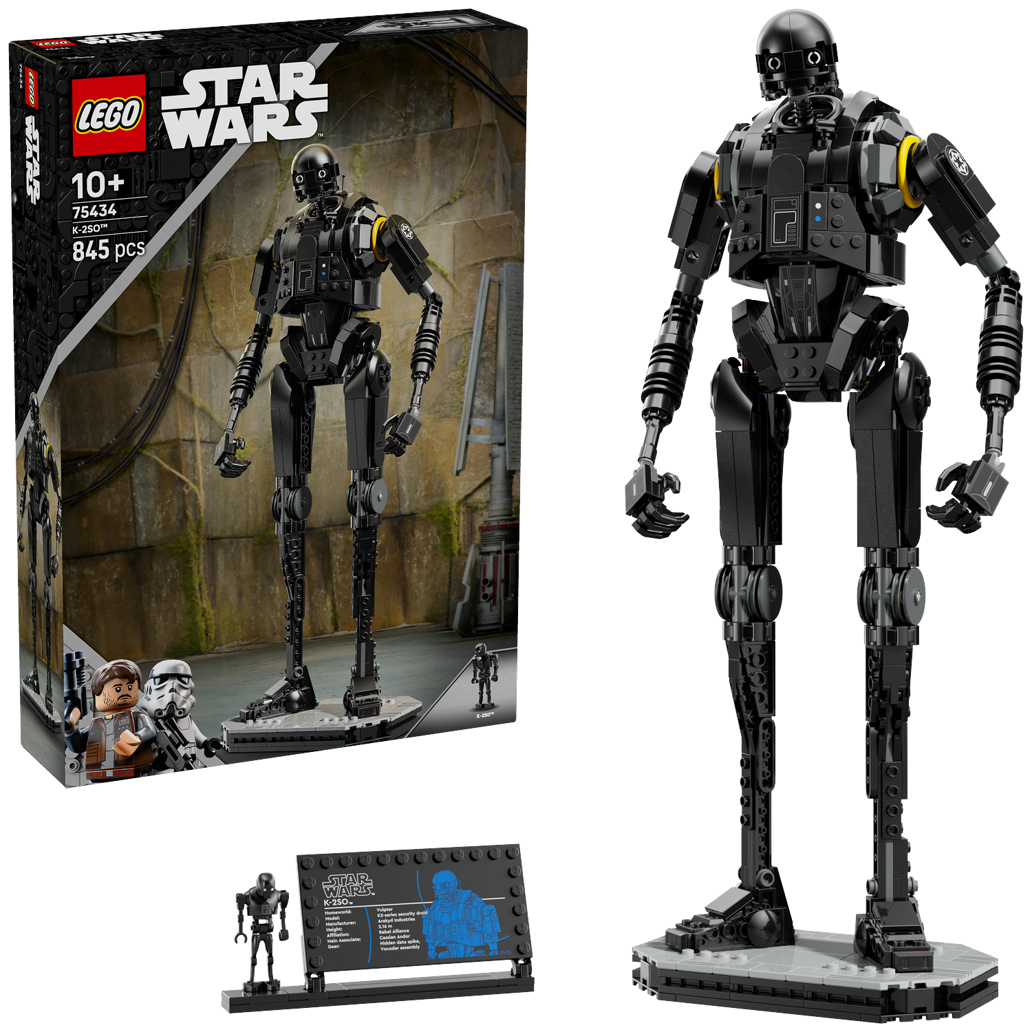 A Lego Star Wars K-2SO figure. It is black and gray, on a gray base. A Lego box is on the left.