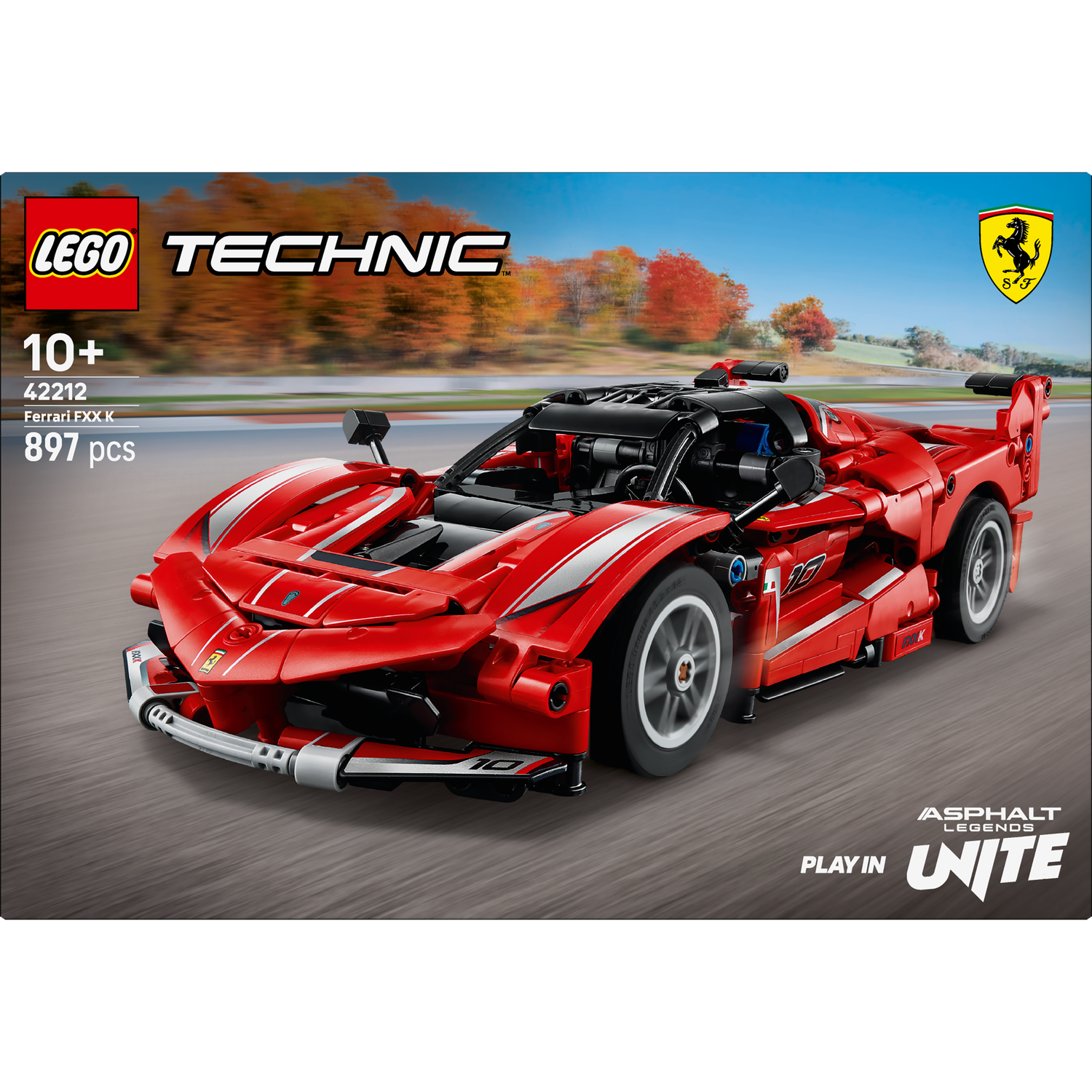 A red Lego Technic Ferrari FXX K race car on a race track. The car has white stripes and black accents.