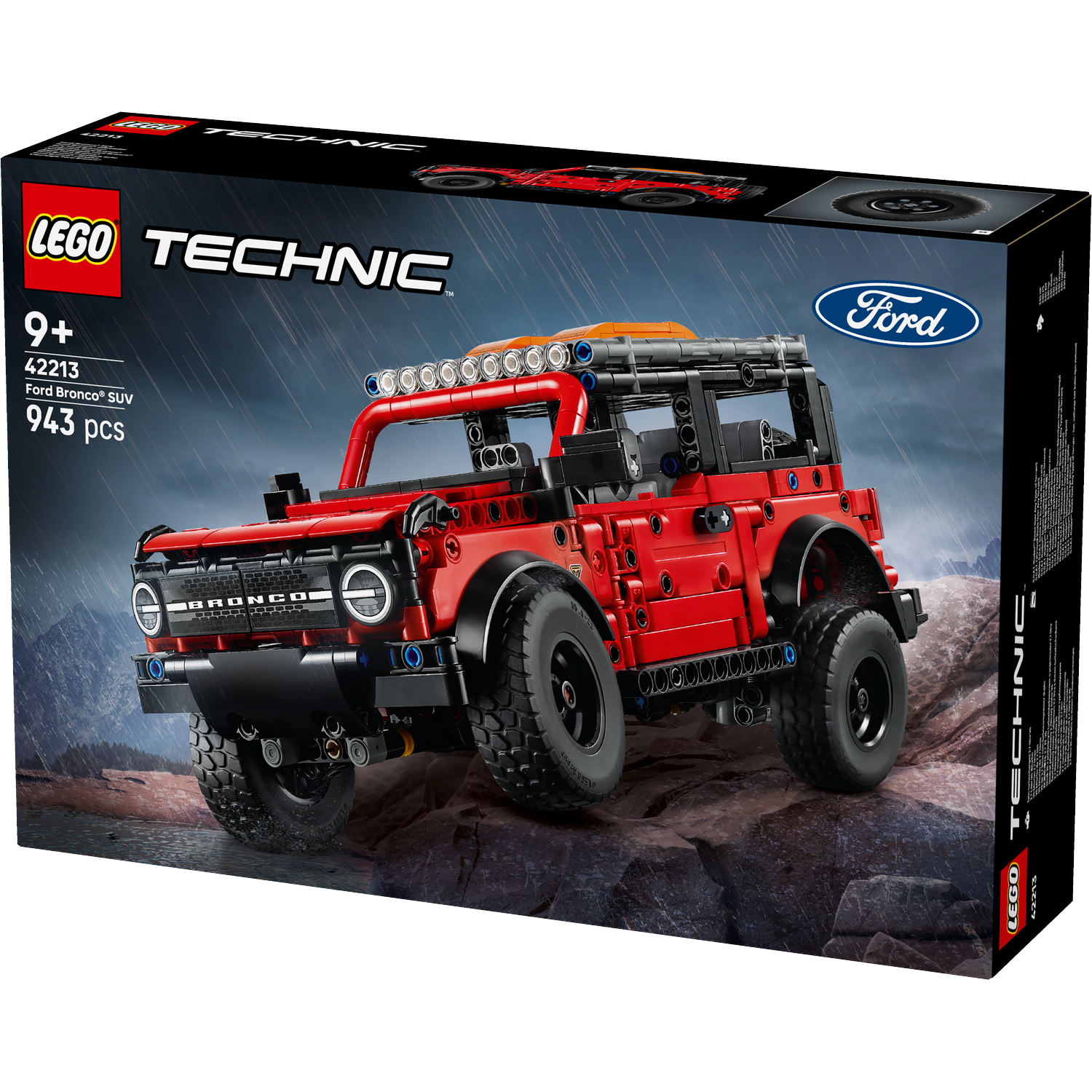 A Lego Technic box shows a red Ford Bronco SUV model. The box has the Lego and Ford logos. It's on a rocky background.
