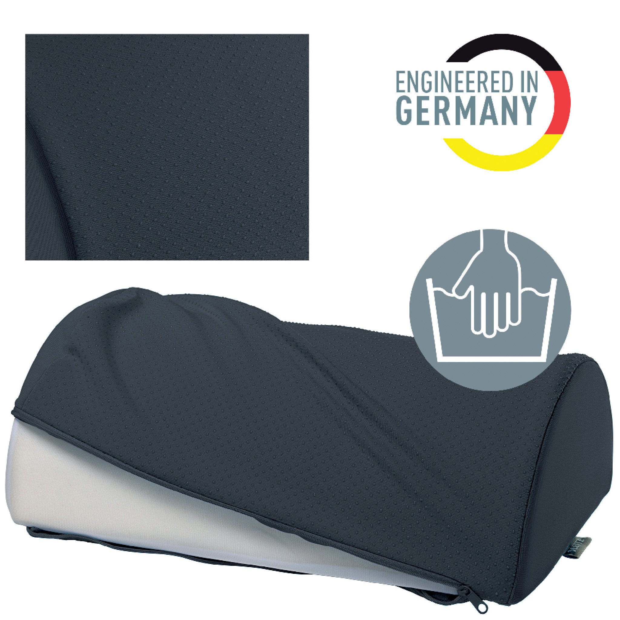 Ein dunkelblaues Kissen mit Reißverschluss. Das Kissen ist mit einem gepunkteten Stoff bedeckt. Es gibt ein Logo mit der Aufschrift 'Engineered in Germany'.