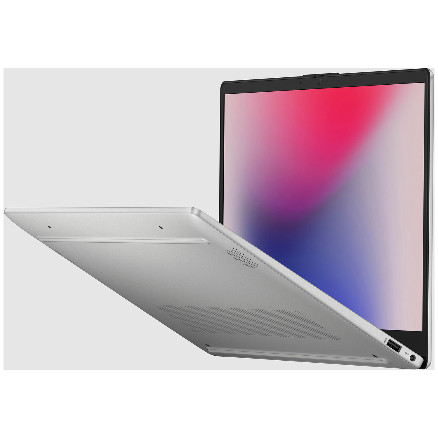Een zilveren laptop is open, met een kleurrijk scherm. Het deksel is gedeeltelijk open, waardoor het toetsenbord en scherm zichtbaar zijn.
