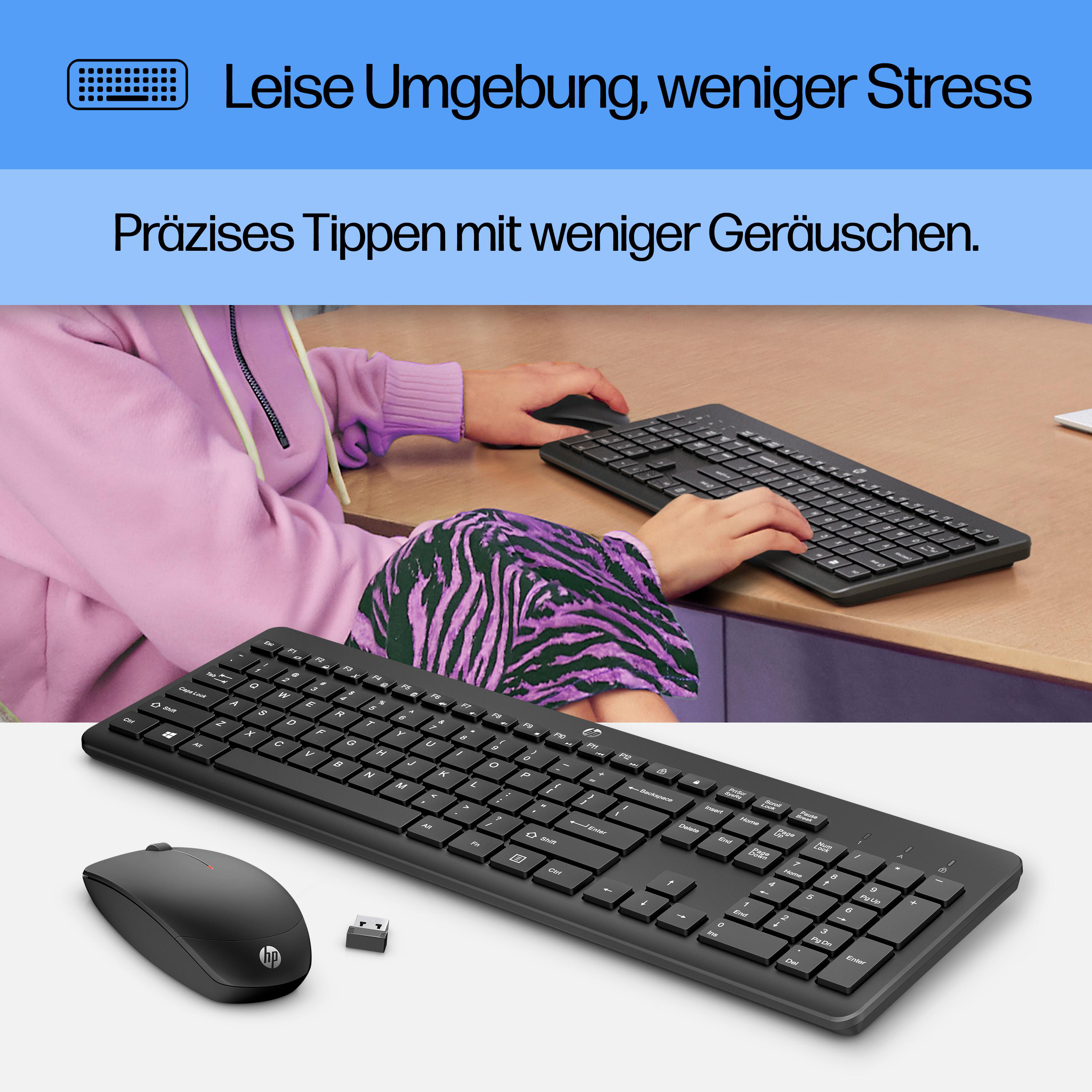Eine Person benutzt eine schwarze Tastatur und Maus. Lila Kapuzenpulli und Zebra-Hosen sind sichtbar. Der Hintergrund ist ein Schreibtisch.