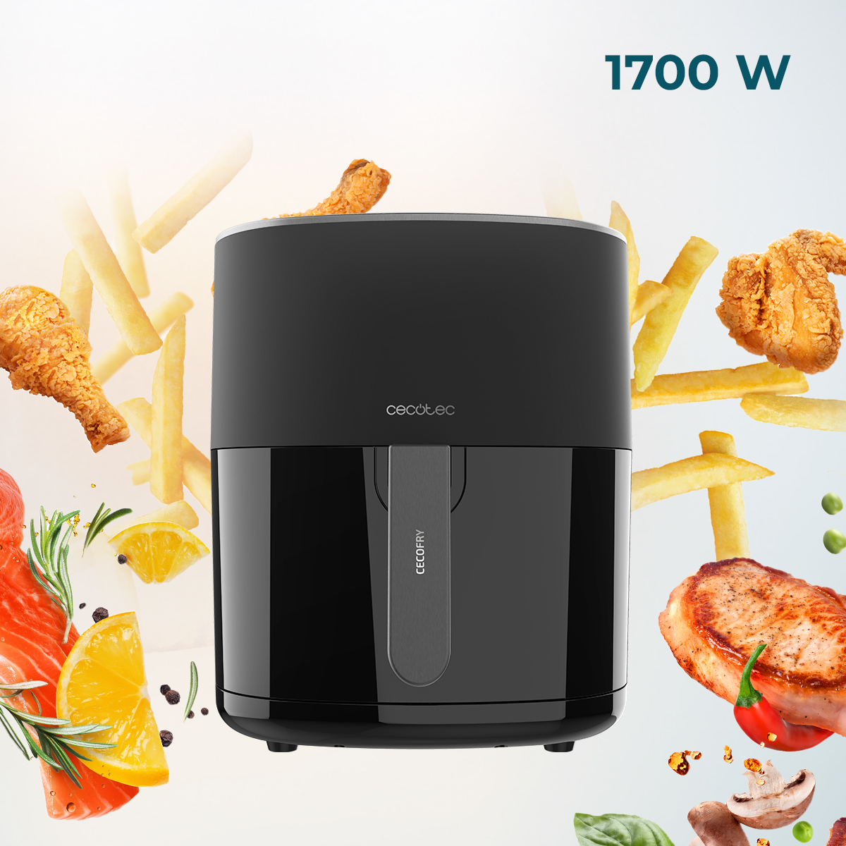 Freidora de aire negra con pollo, papas fritas, salmón, limón y otros ingredientes. Se muestra una potencia de 1700 W.