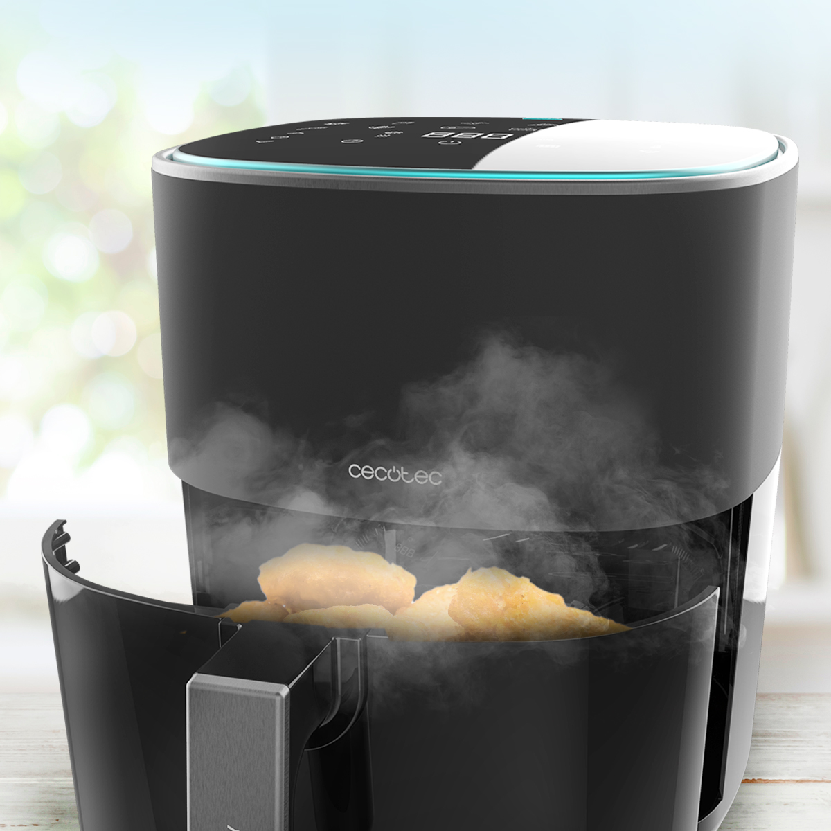 Una freidora de aire negra con comida dentro, vapor subiendo. Fondo verde borroso. Pantalla digital arriba.