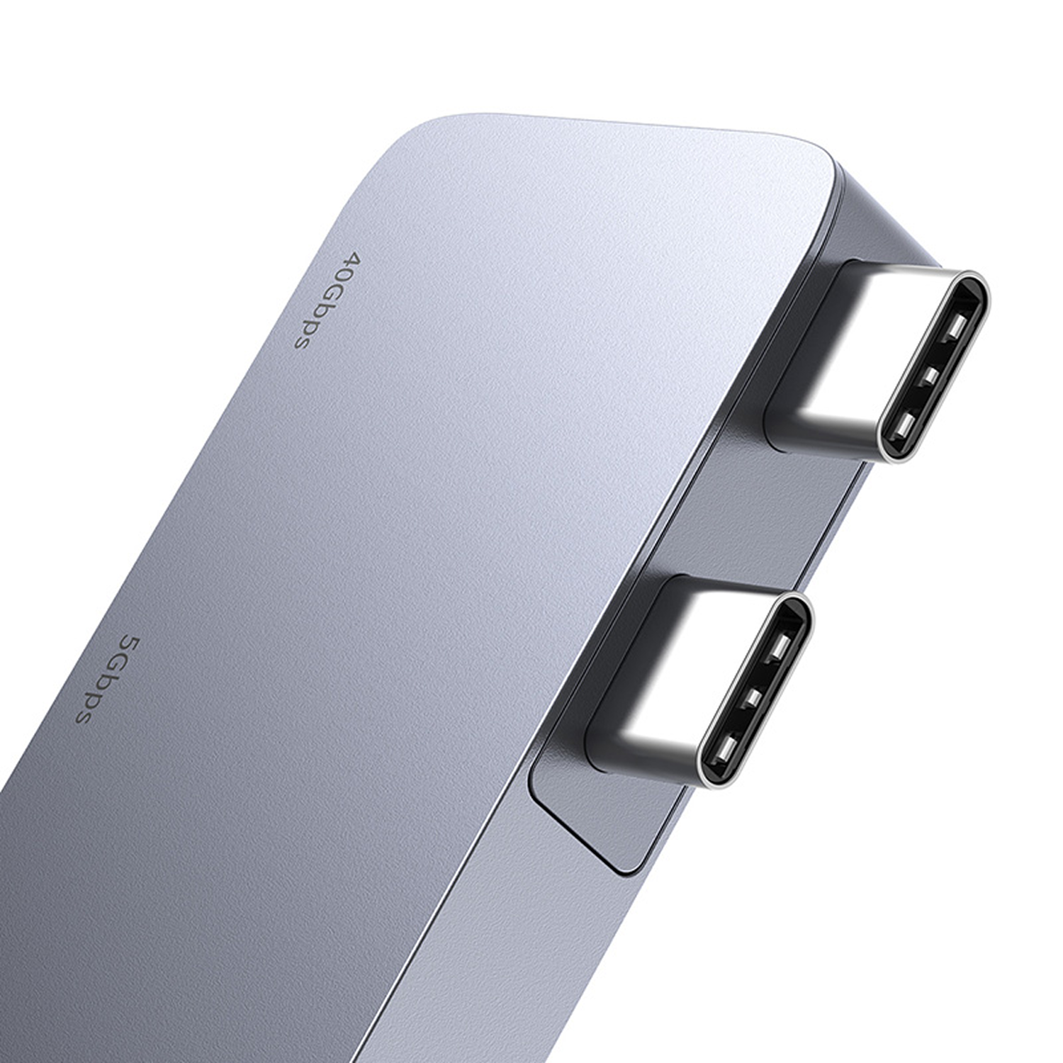 Concentrador USB-C plateado con dos puertos visibles. El texto en el concentrador dice '40Gbps' y '5Gbps'.