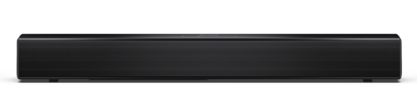 Czarny soundbar z siatkowym przodem, logo SHARP i przyciskami na górze. Stoi na białej powierzchni.