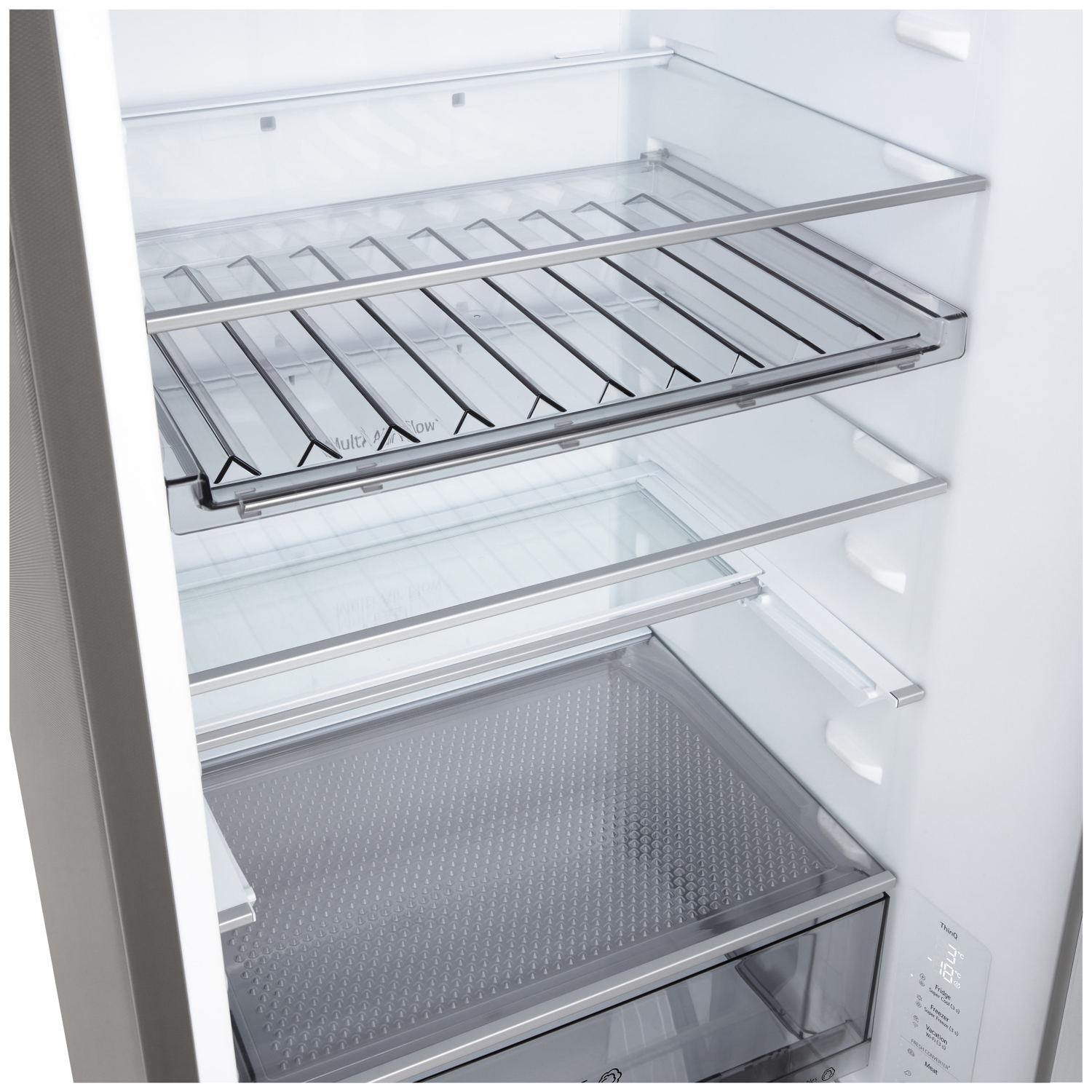 Inside a refrigerator, showcasing glass shelves and drawers. The interior is white, with stainless steel accents. A temperature display is visible.
