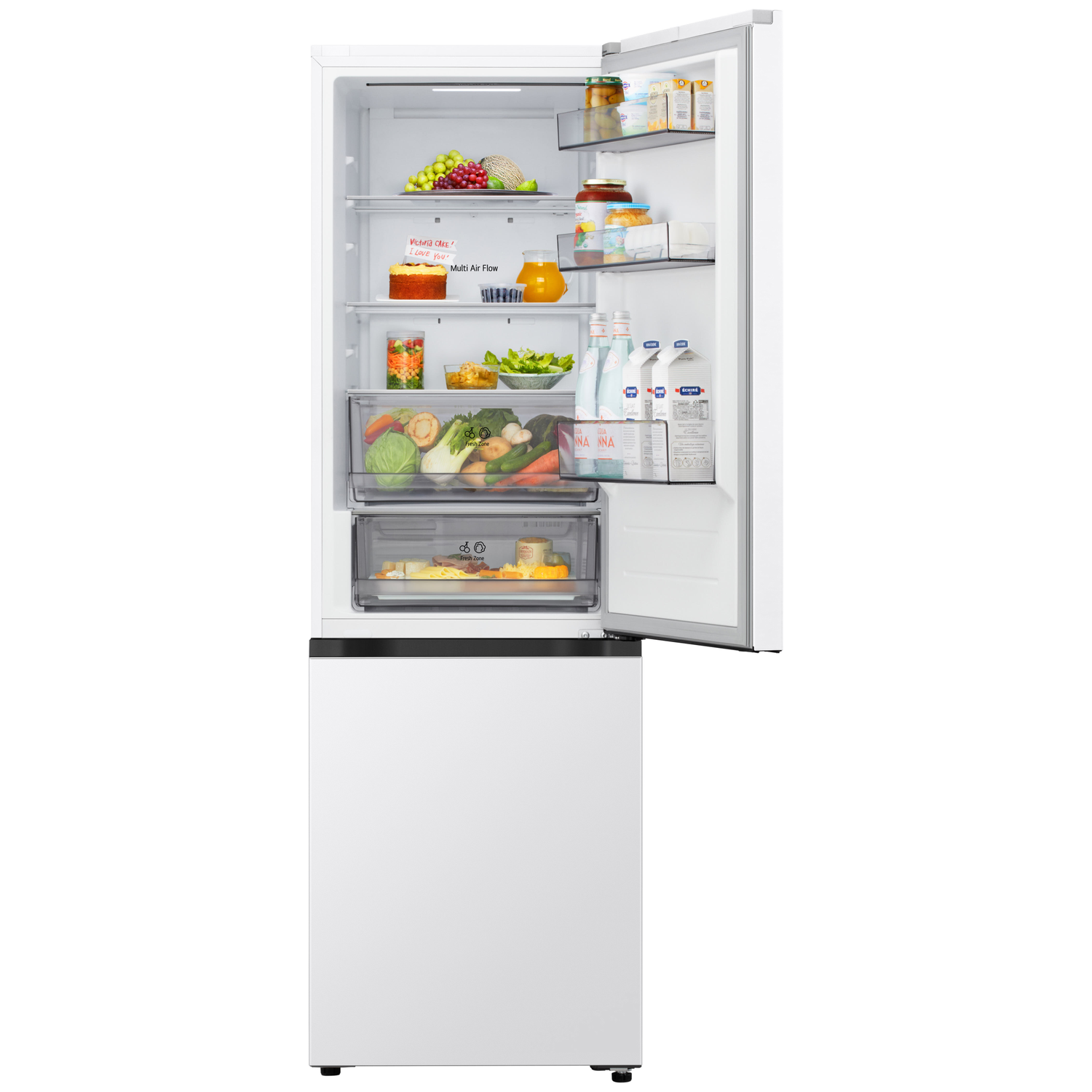 Open white refrigerator filled with food: fruits, vegetables, drinks, and a cake. The door is open.