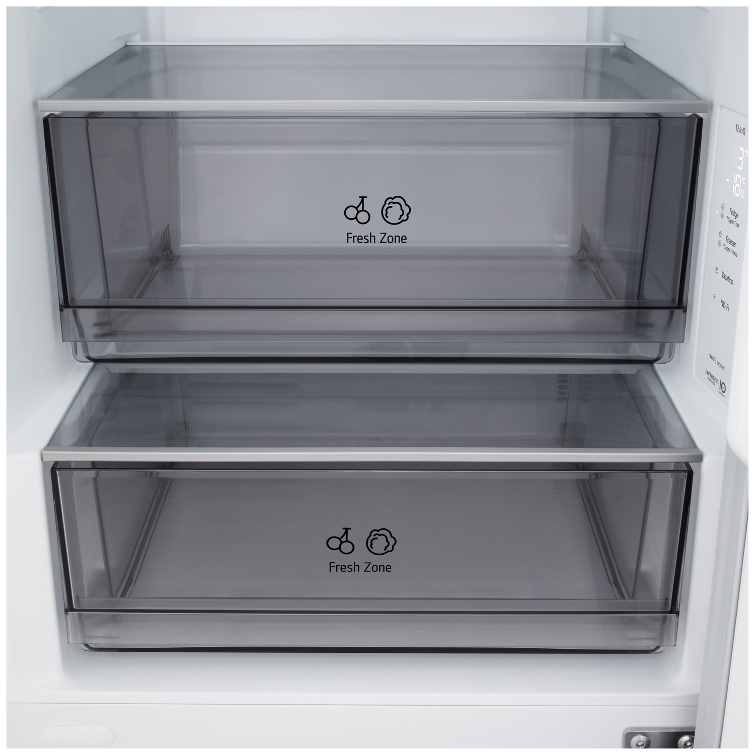 Inside a refrigerator, two transparent drawers labeled 'Fresh Zone' are visible. The inside is empty. The fridge door is open.