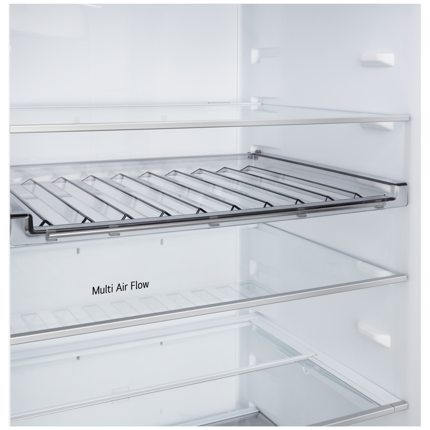 Inside of a refrigerator with glass shelves and metal trims. The words 'Multi Air Flow' are visible.