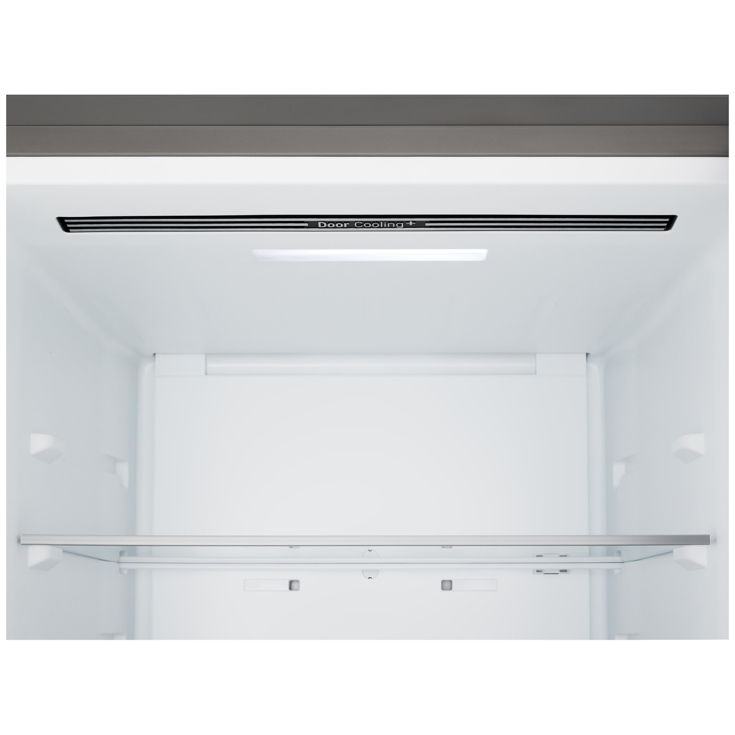 Inside of a refrigerator. It has a glass shelf, a light, and a vent labeled 'Door Cooling +'.