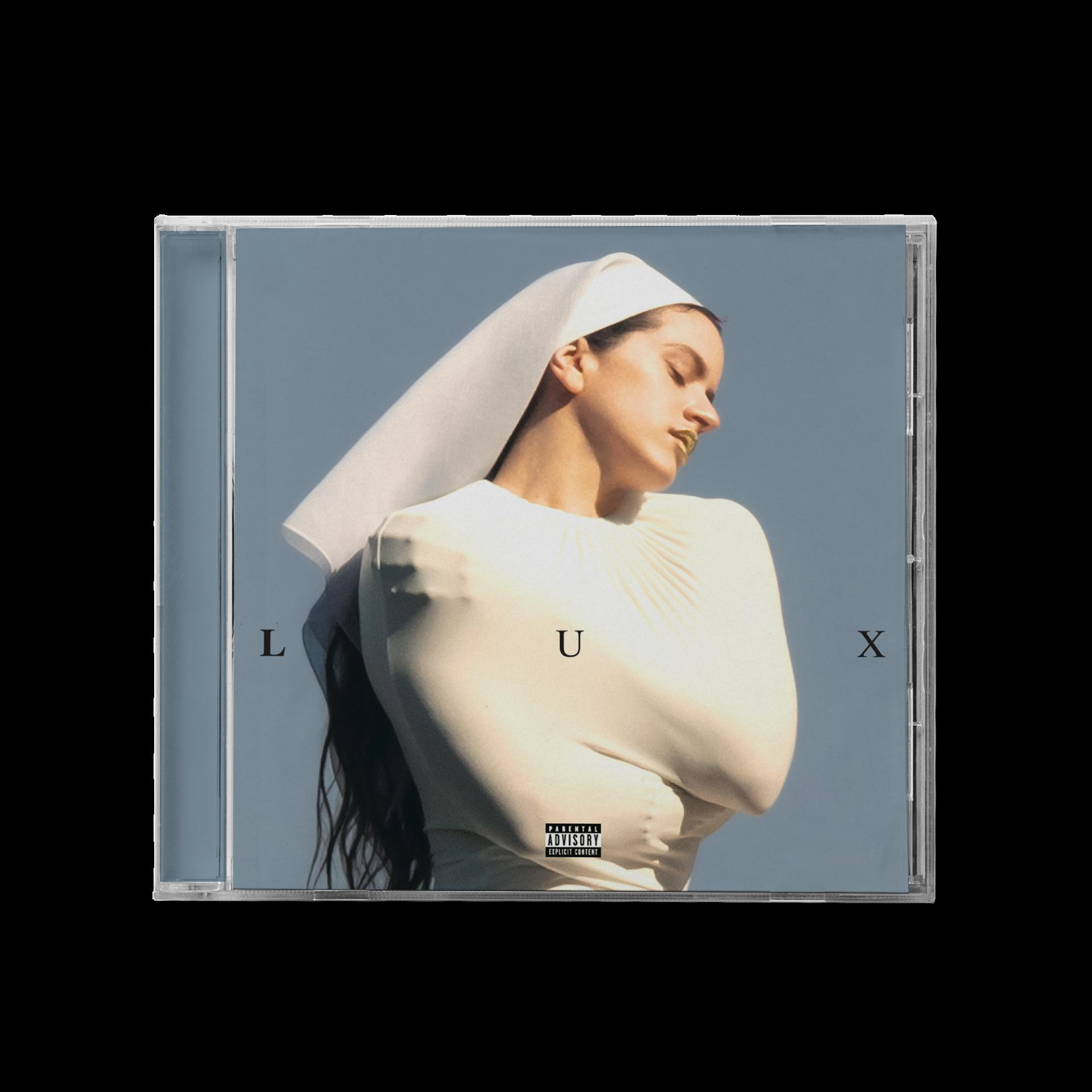 Albumcover: Frau in weißem Outfit, Nonnentracht. Wörter 'LUX'. Warnhinweis für Eltern.