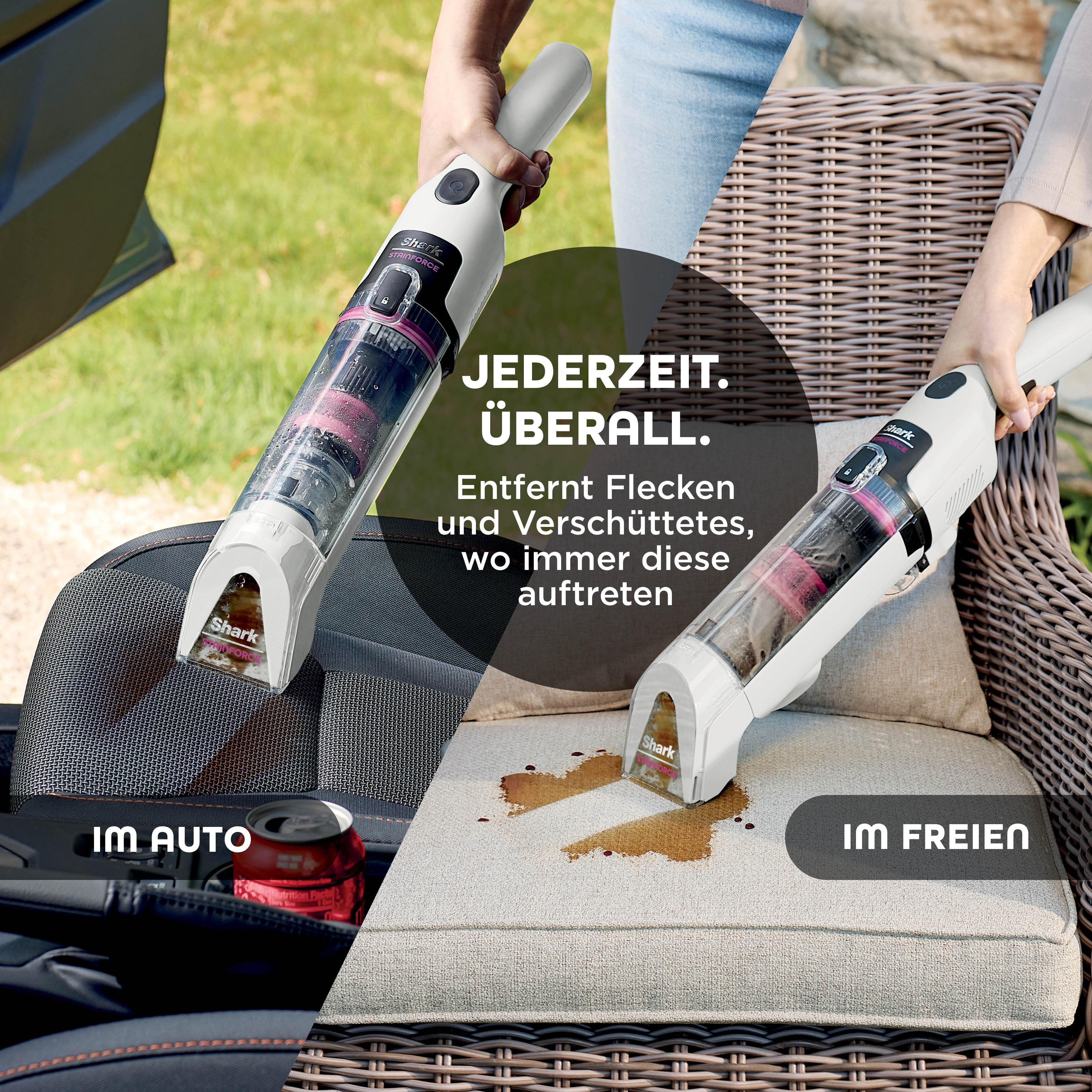 Das Bild zeigt einen Shark Stainforce-Staubsauger, der einen Autositz und ein Outdoor-Kissen mit Verschüttungen reinigt.