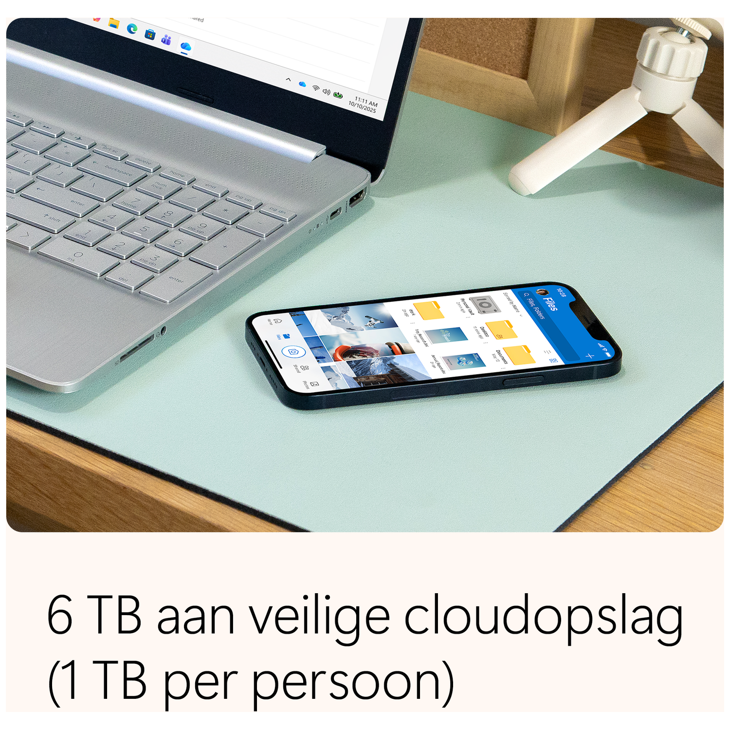 Laptop, smartphone on a desk. The phone displays files. Text below says, '6 TB safe cloud storage (1 TB per person)'.