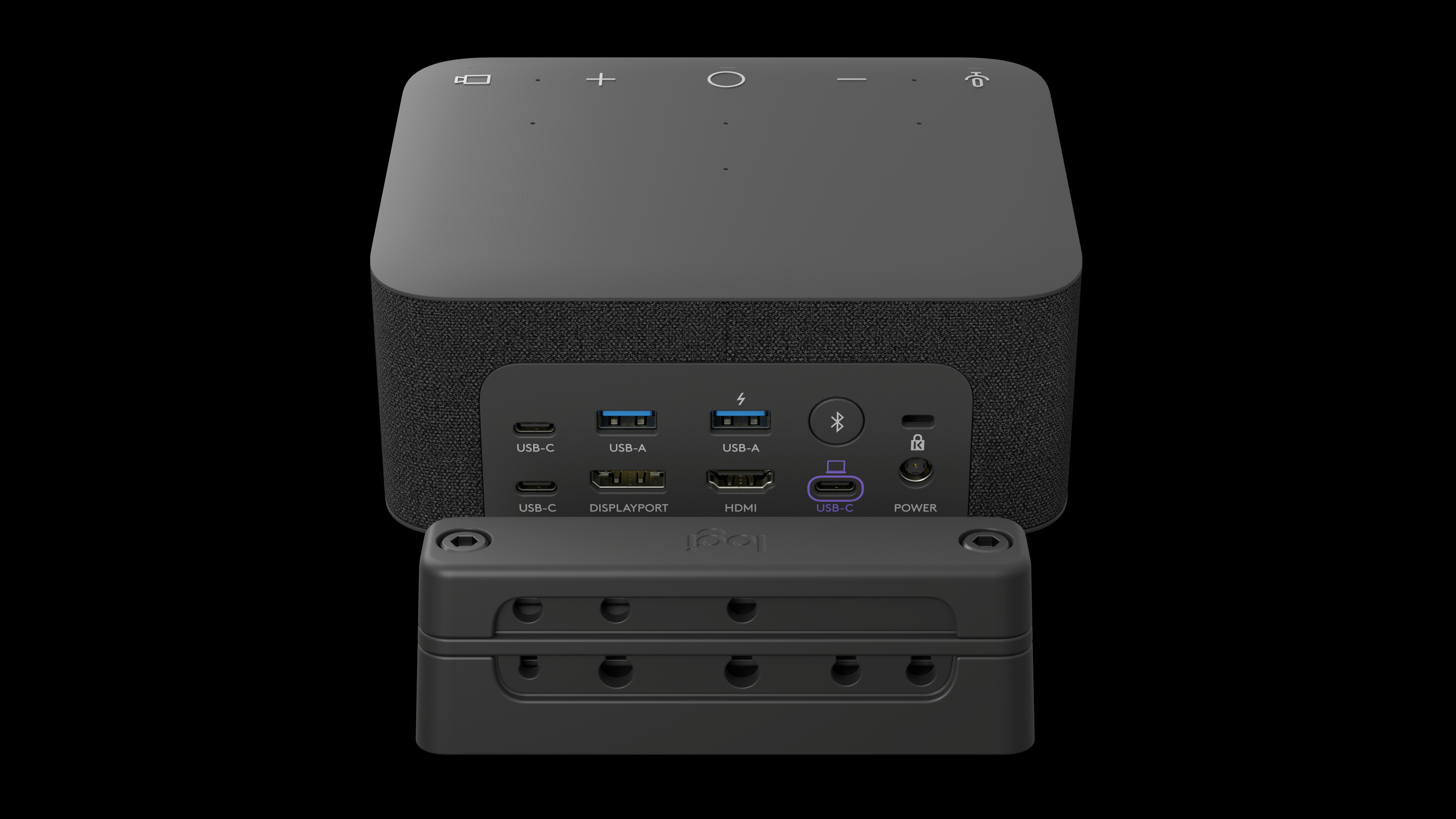Ein schwarzes Gerät mit Anschlüssen und einer schwarzen Basis. USB-Anschlüsse, HDMI und Stromeingang sind sichtbar. Schwarzer Hintergrund.