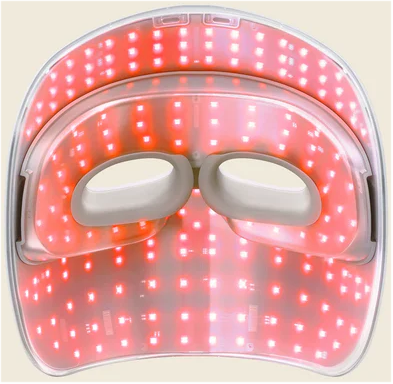 LED-Lichttherapiemaske. Sie hat mehrere rote Lichter und Augenlöcher. Der Rahmen ist weiß.