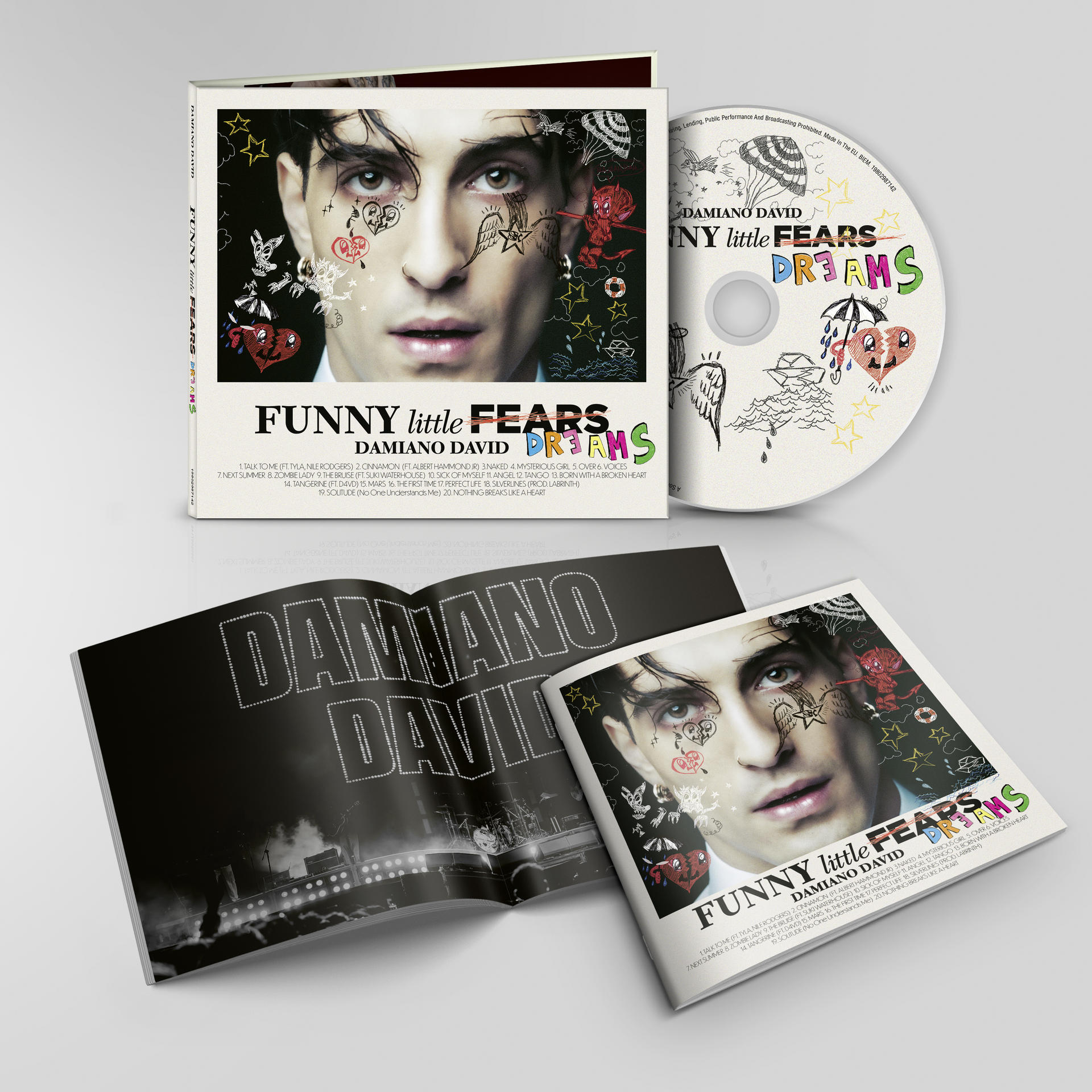 Albumcover: Damiano Davids Gesicht mit aufgemalten Tattoos. CD und Booklet mit Albumtitel 'Funny Little Fears Dreams'.