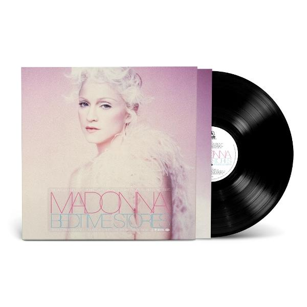 Das Albumcover von Madonna, 'Bedtime Stories', zeigt ihr Gesicht, weißes Haar und eine Schallplatte. Rosa- und Weißtöne sind im Cover enthalten.