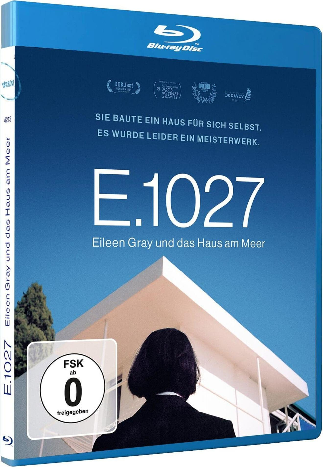 Blu-ray-Cover. Titel: E.1027, Eileen Gray und das Haus am Meer. Enthält Auszeichnungen und eine Frau in schwarzem Anzug, die ein Gebäude betrachtet.