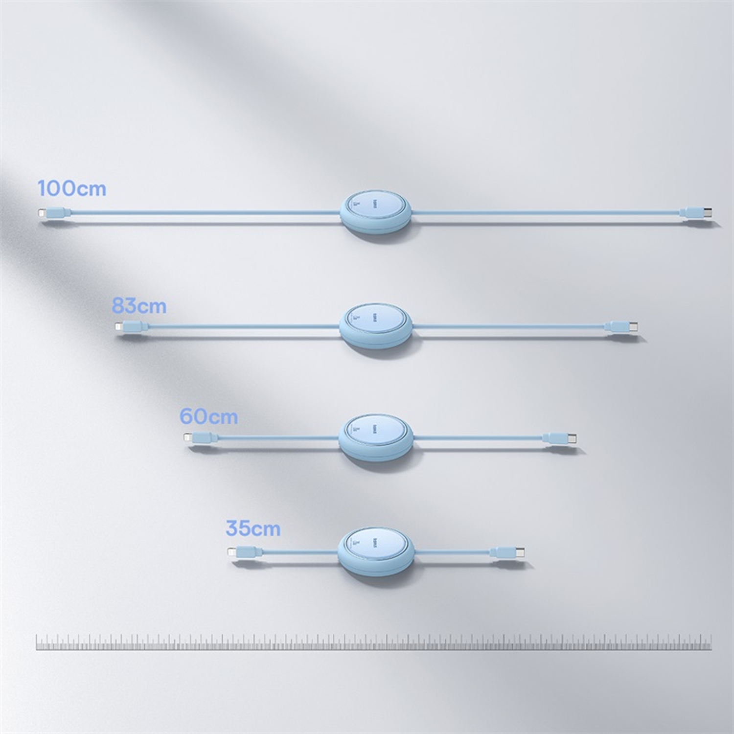 Se muestran cuatro cables de carga azul claro de diferentes longitudes (100 cm, 83 cm, 60 cm, 35 cm), junto con una escala de medición en la parte inferior.