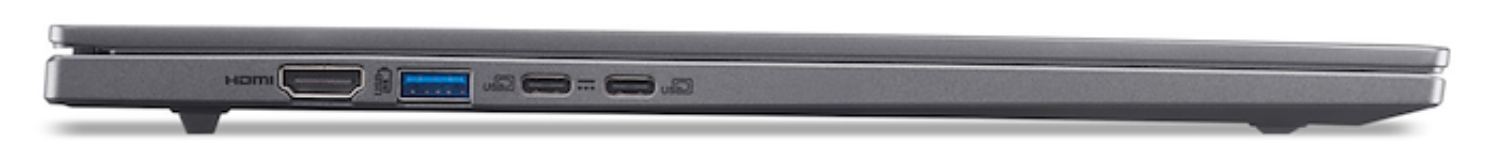 Vista lateral de un portátil gris que muestra puertos: HDMI, USB y puertos de carga. El portátil está elevado.