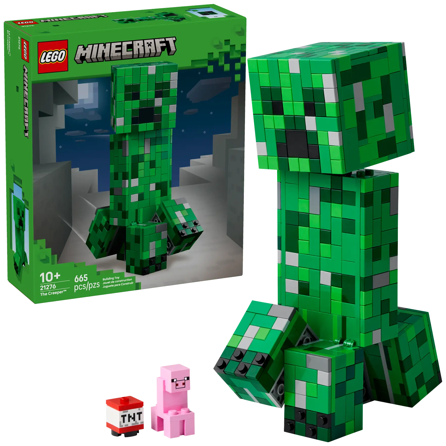 Een Minecraft Lego set, met een groene Creeper figuur, een roze varken en een TNT blok, met de doos op de achtergrond.