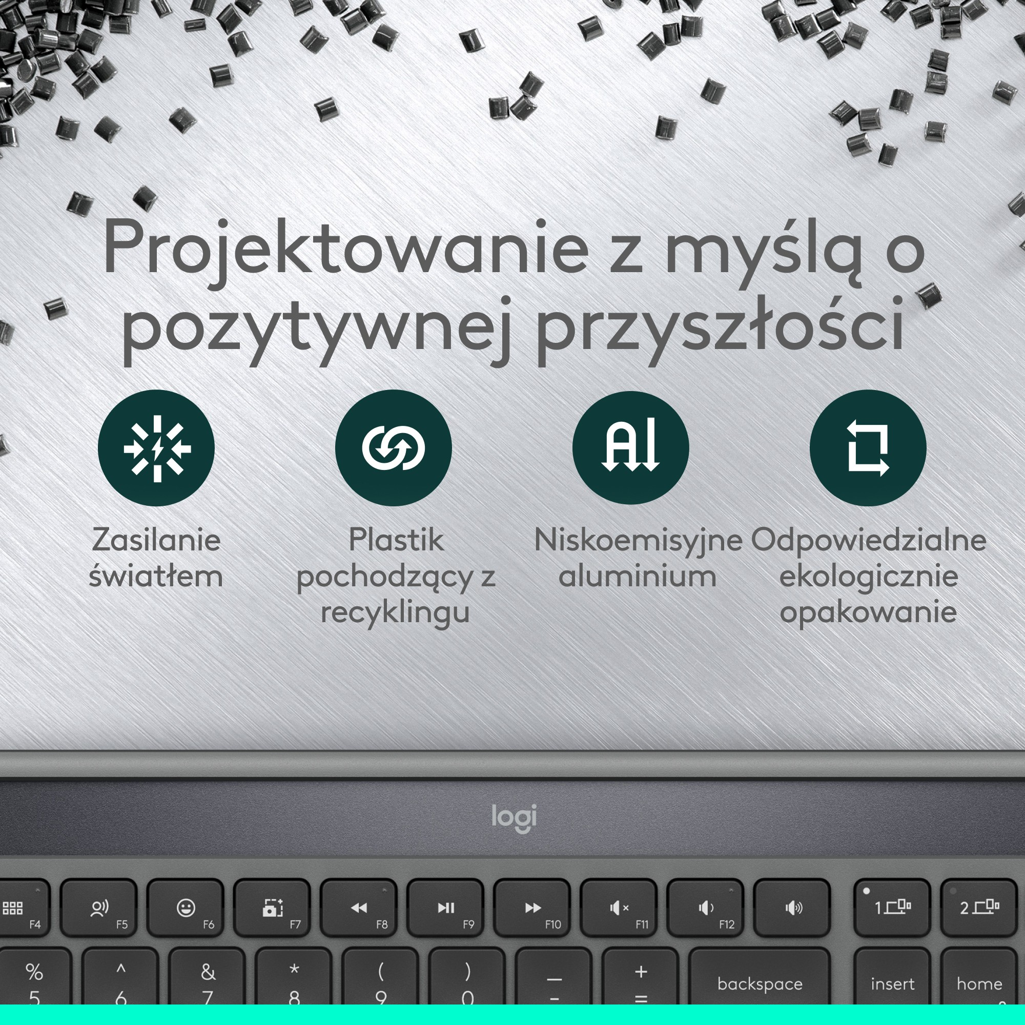 Obraz przedstawia klawiaturę i ikony promujące zrównoważony rozwój, takie jak plastik z recyklingu i aluminium o niskiej emisji.