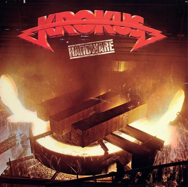 Albumcover. Rotes 'Krokus'-Logo, Text 'HARDWARE'. Industrielle Szene: Geschmolzenes Metall gießt sich in einen Behälter, mit Metallträgern.