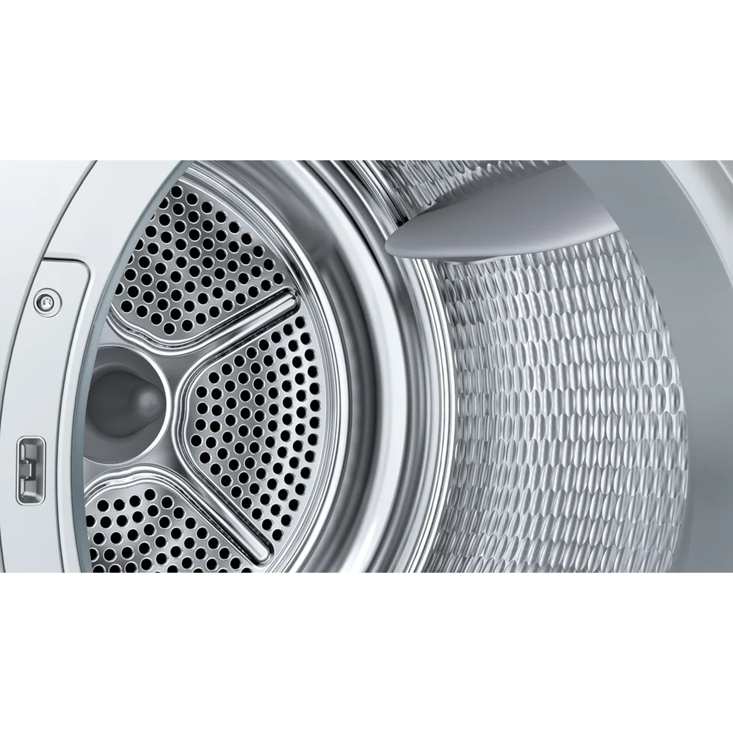 Close-up of a silver washing machine drum interior with a perforated front and a textured back.