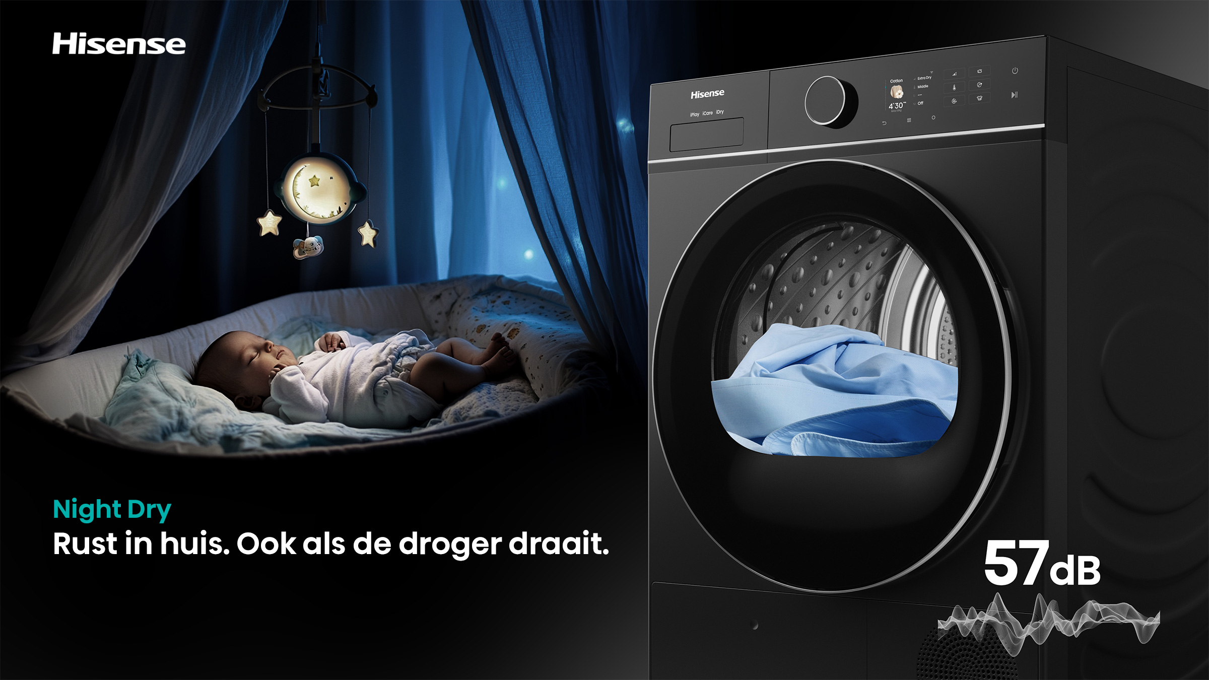 A baby sleeps near a Hisense dryer. The dryer has blue clothes inside. The scene is lit with a night light and says 57dB.