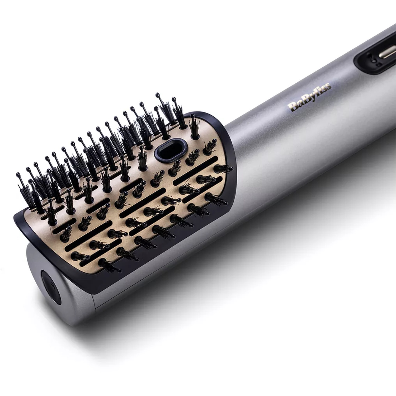 A silver and black Babyliss hair styler. The brush head is gold with black bristles. The handle is silver.