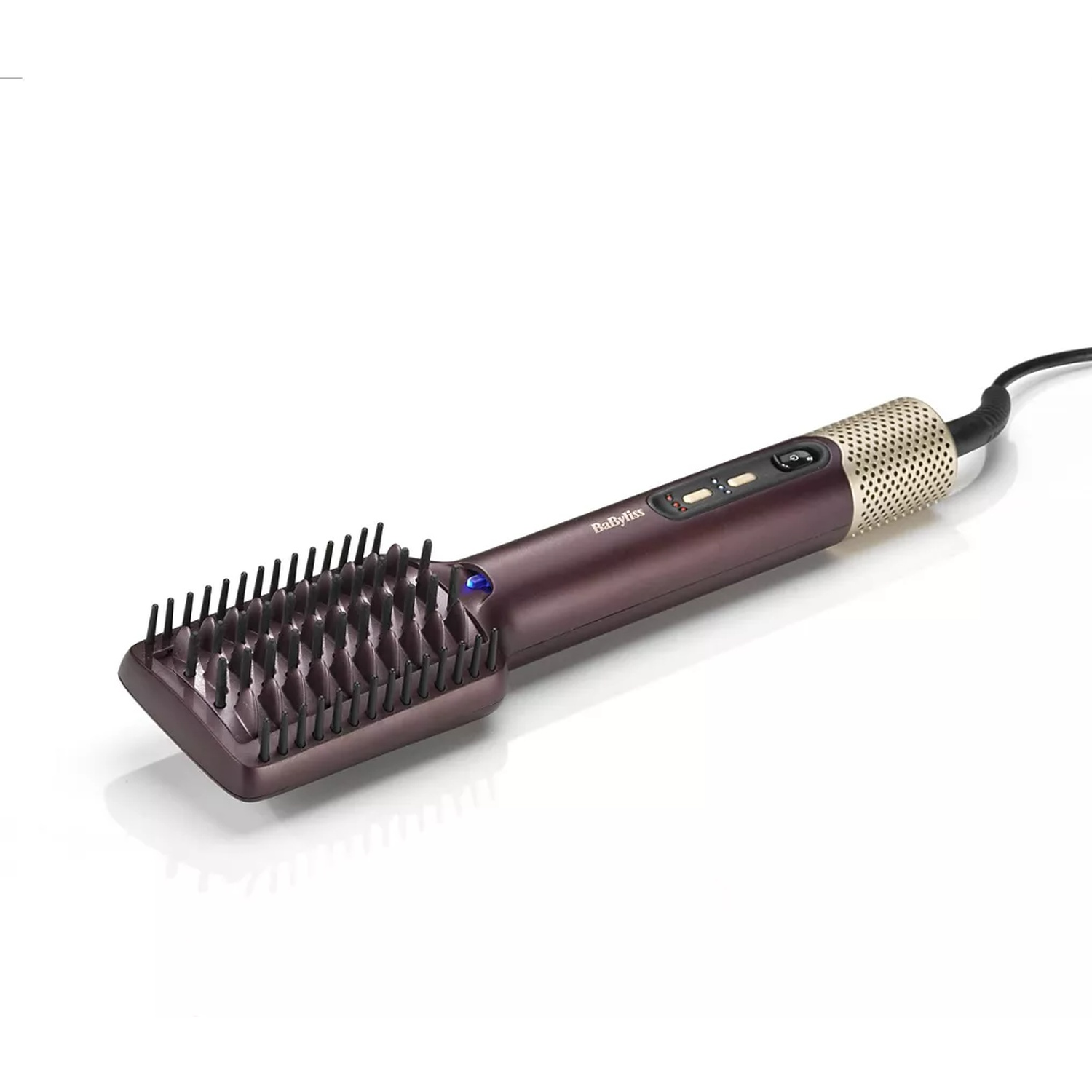 A hair straightening brush, purple and gold, on a white surface. It has bristles and a handle with buttons and power cord.