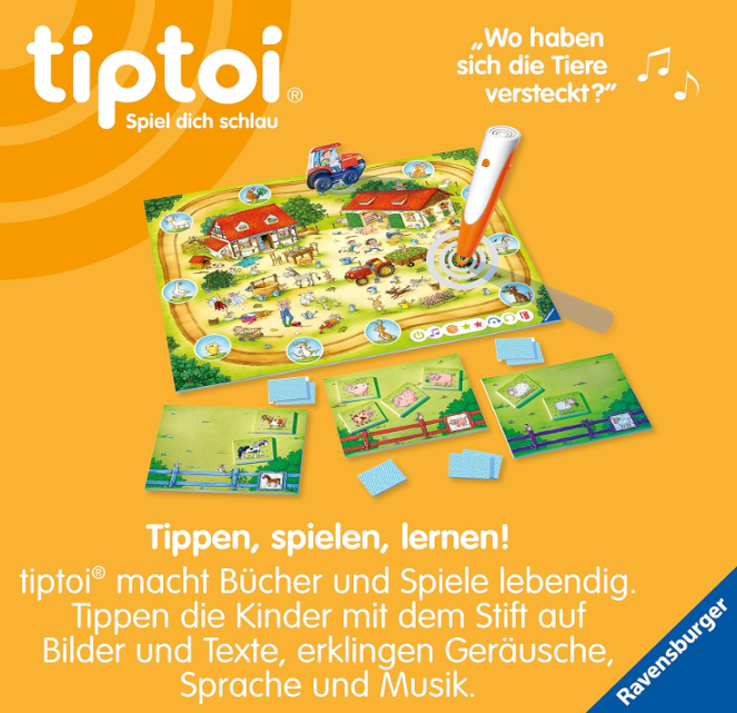 Ein Spielbrett mit einer Bauernhofszene, einem roten Traktor und einem interaktiven Stift. Karten mit Tierbildern sind um das Brett gelegt.