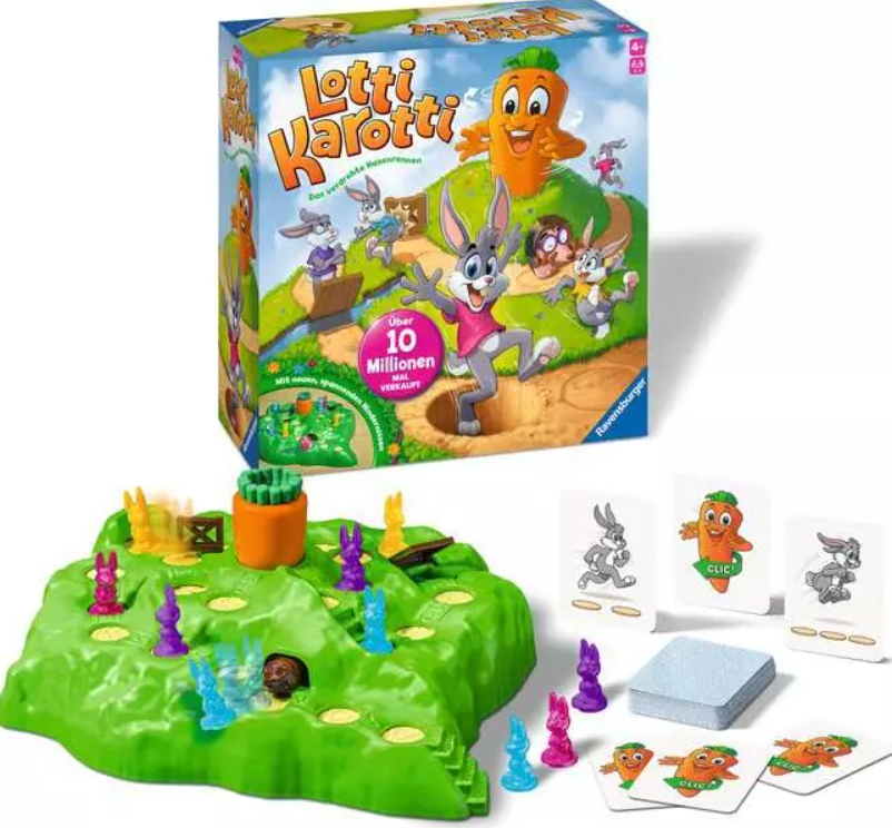 Das Spiel Lotti Karotti wird angezeigt. Es umfasst ein Spielbrett mit Hasenfiguren, Karten und die Spielbox mit einem Hasen.