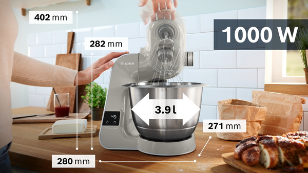 Egy szürke Bosch konyhai gép, méretekkel. Rozsdamentes acél tálja 3,9L, teljesítménye 1000W.