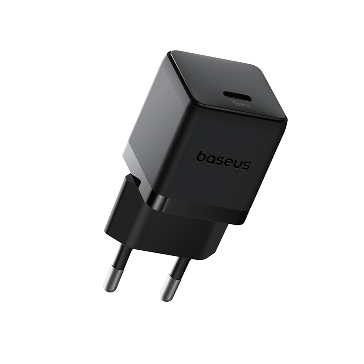 Un cargador Baseus Type-C negro. Tiene dos clavijas y un cuerpo cuadrado. La marca es visible. El fondo es blanco.