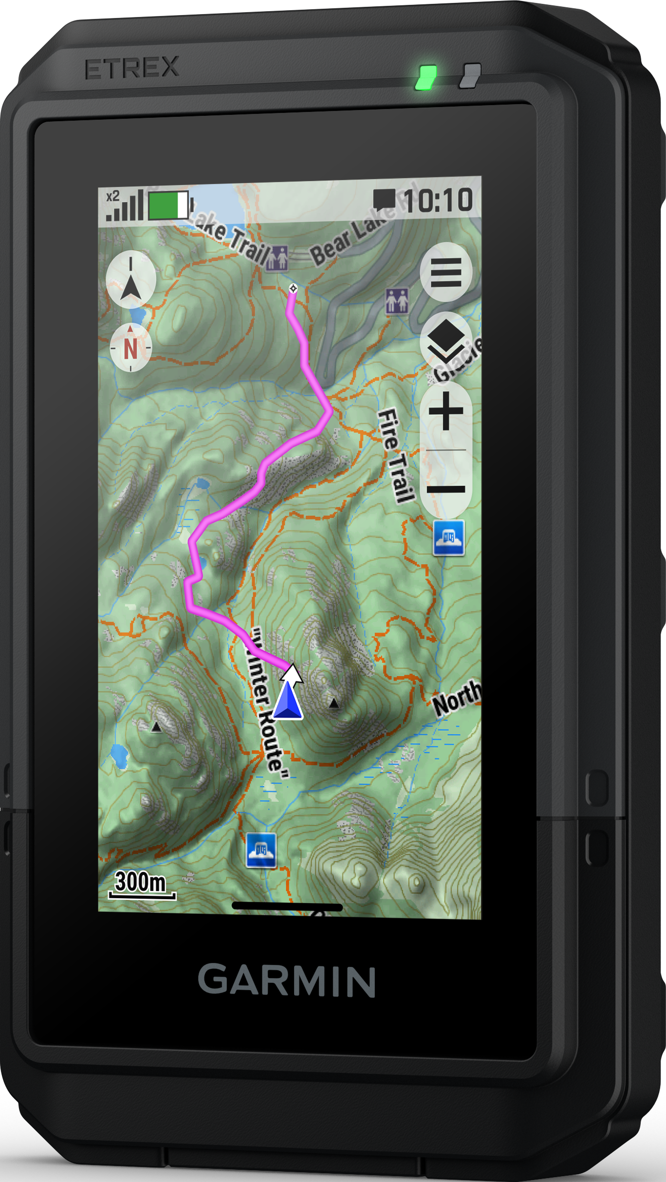 Ein Garmin eTrex GPS-Gerät zeigt eine Karte mit einem rosa Pfad an. Die Uhrzeit ist 10:10. Oben leuchten grüne und graue Lichter.