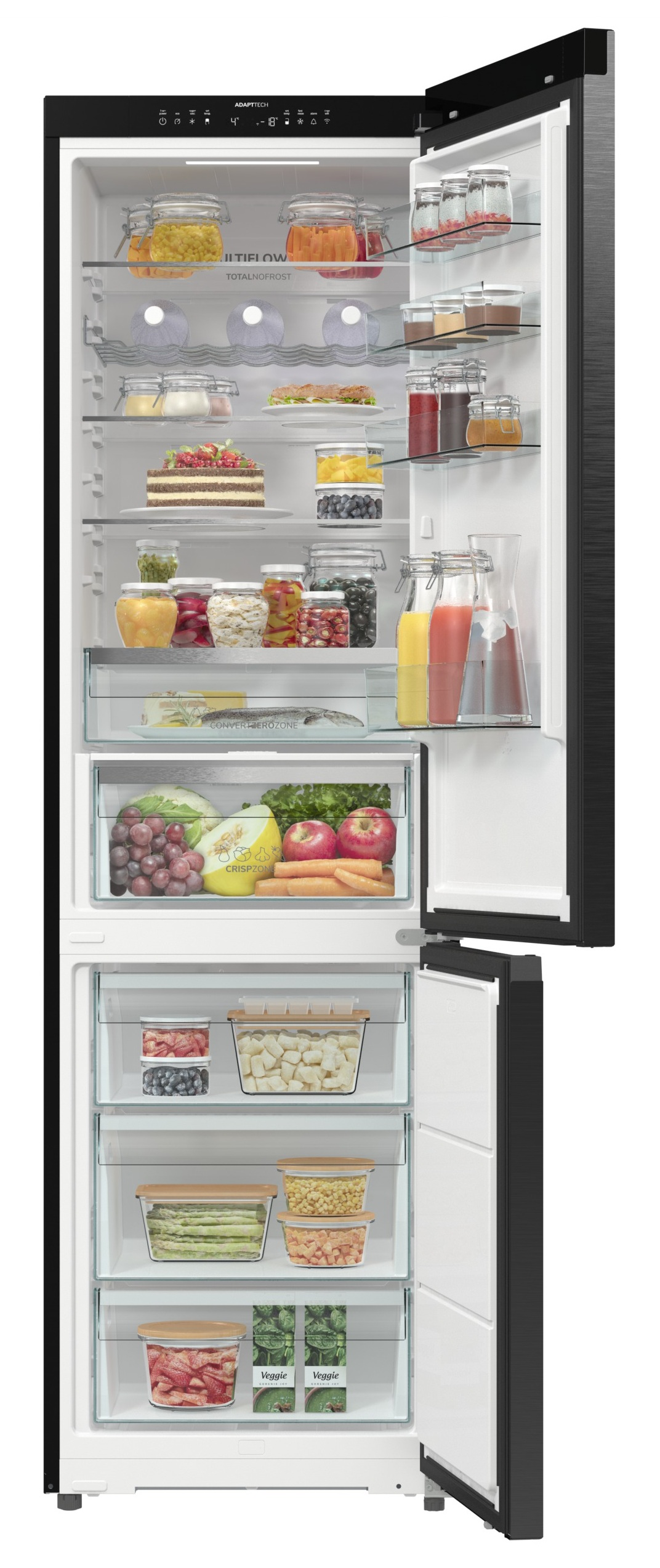 Otwarta lodówka wypełniona jedzeniem: owoce, warzywa, ciasta, słoiki z jedzeniem i soki. Czarny na zewnątrz, biały wewnątrz. Drzwi są otwarte.