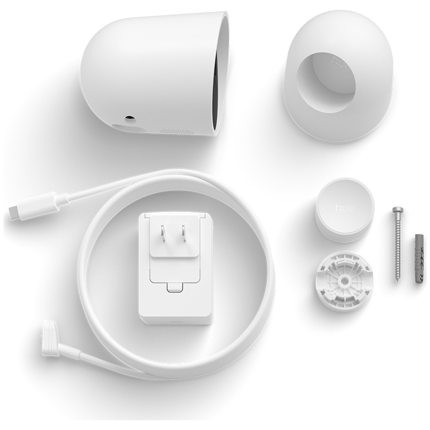 White security camera and accessories on white background. Includes camera, mounting hardware, power adapter, and cable.