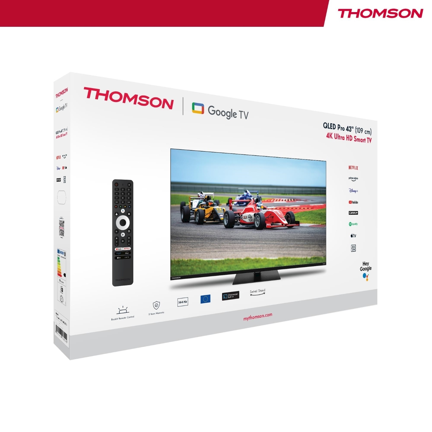 Una scatola Thomson Google TV con un televisore che mostra auto da corsa. Include un telecomando, il logo Netflix e il logo Hey Google.