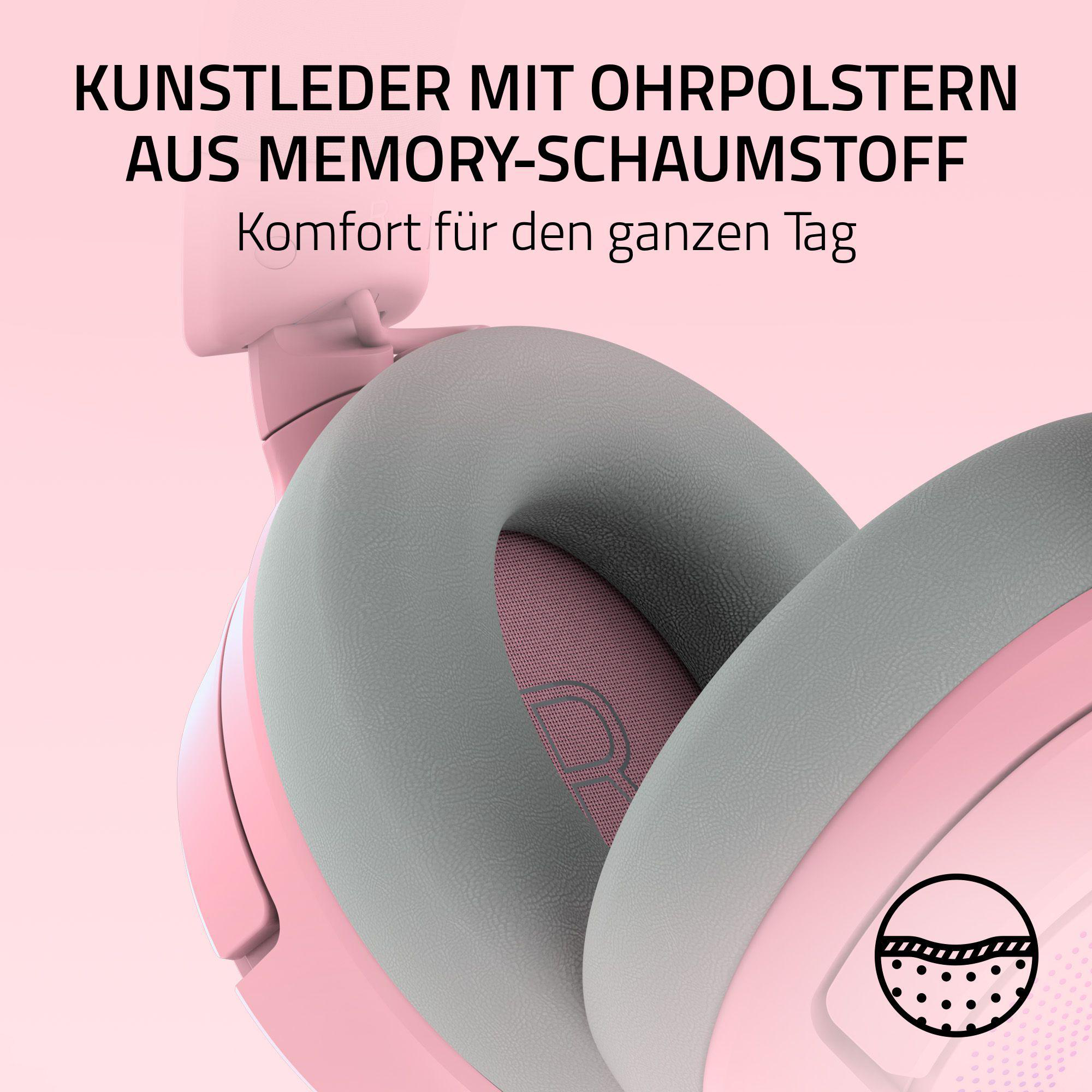 Rosa Kopfhörer mit grauen Ohrmuscheln. Text: 'Kunstleder mit Ohrpolstern aus Memory-Schaumstoff'. Komfort für den ganzen Tag.