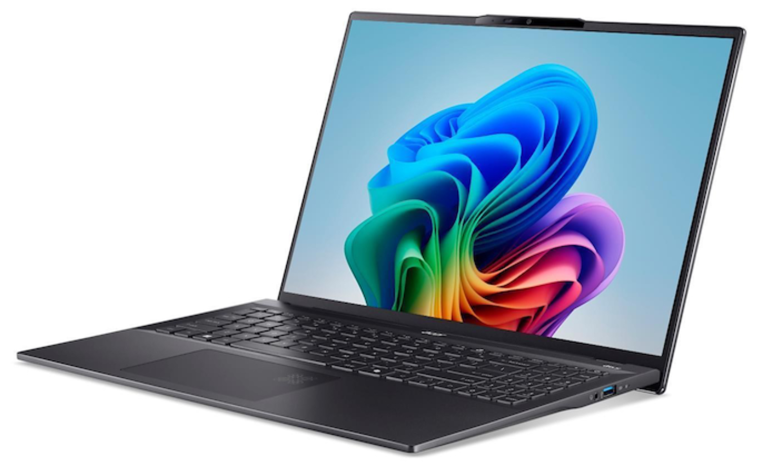 Una laptop gris oscuro está abierta, mostrando una imagen abstracta colorida. Se ven el teclado y el panel táctil.