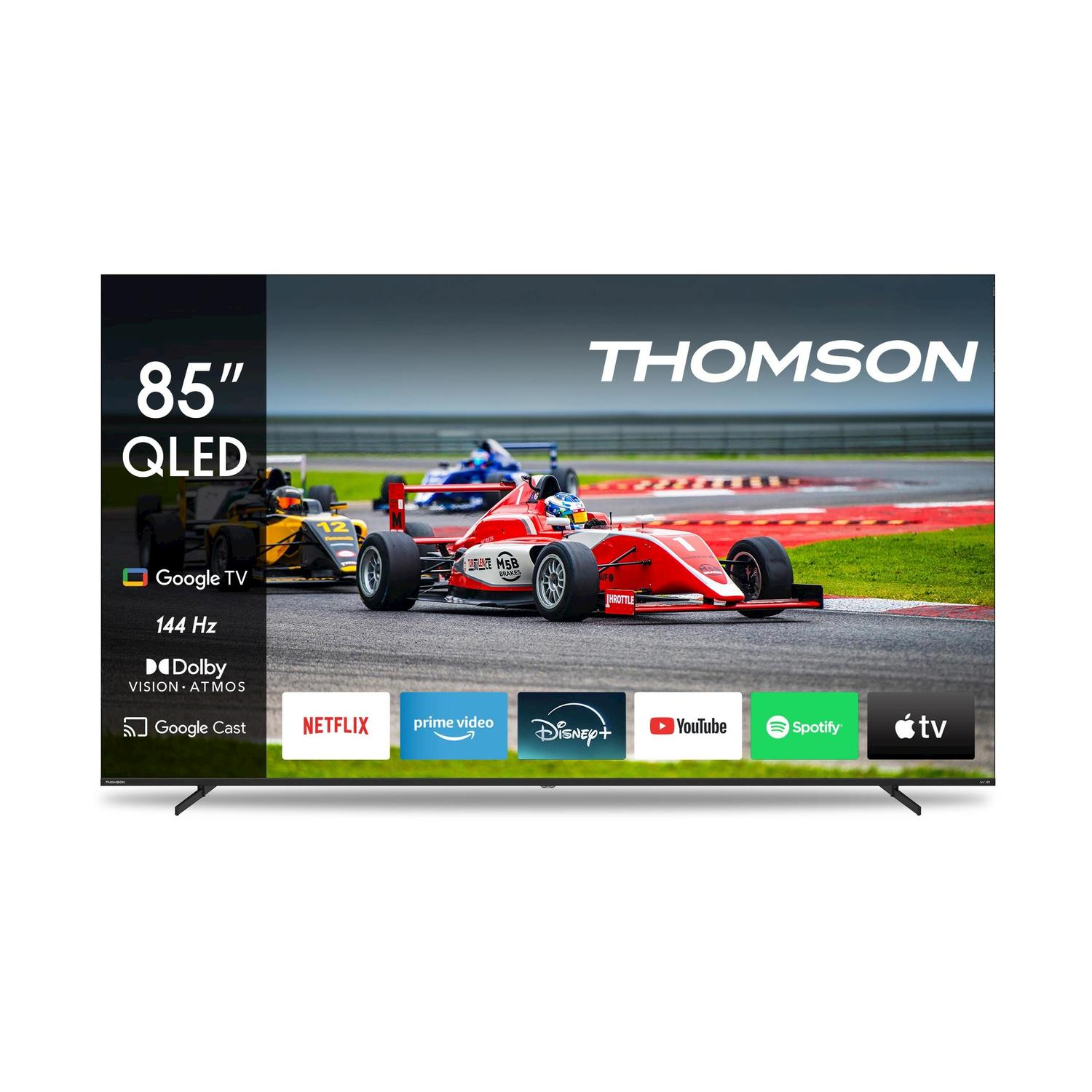 Un televisore Thomson QLED da 85 pollici mostra una gara con auto da corsa rosse e gialle. Le icone delle app di streaming sono sotto lo schermo.